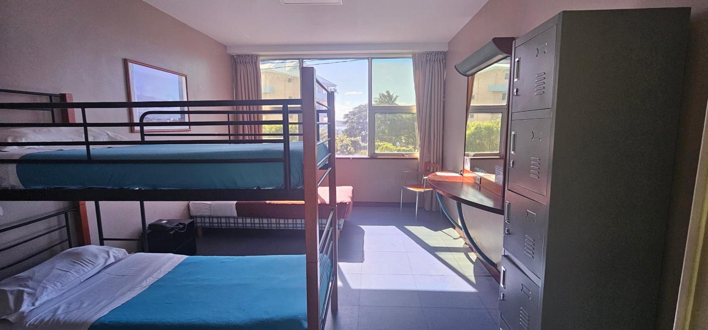 Single Bed In Male Dormitory Room photo 1