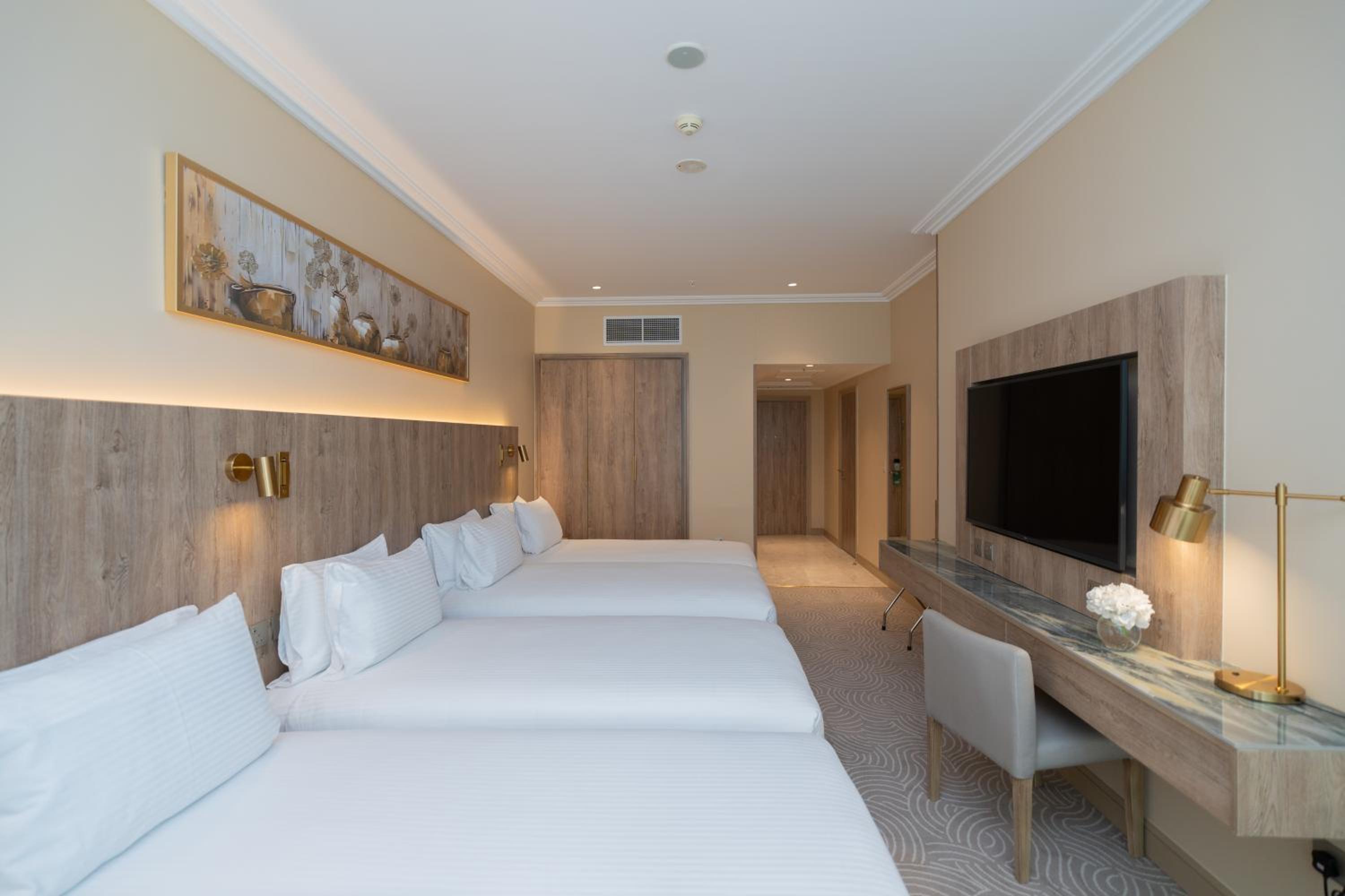 Classic Room with Four Single Beds and Partial Haram View