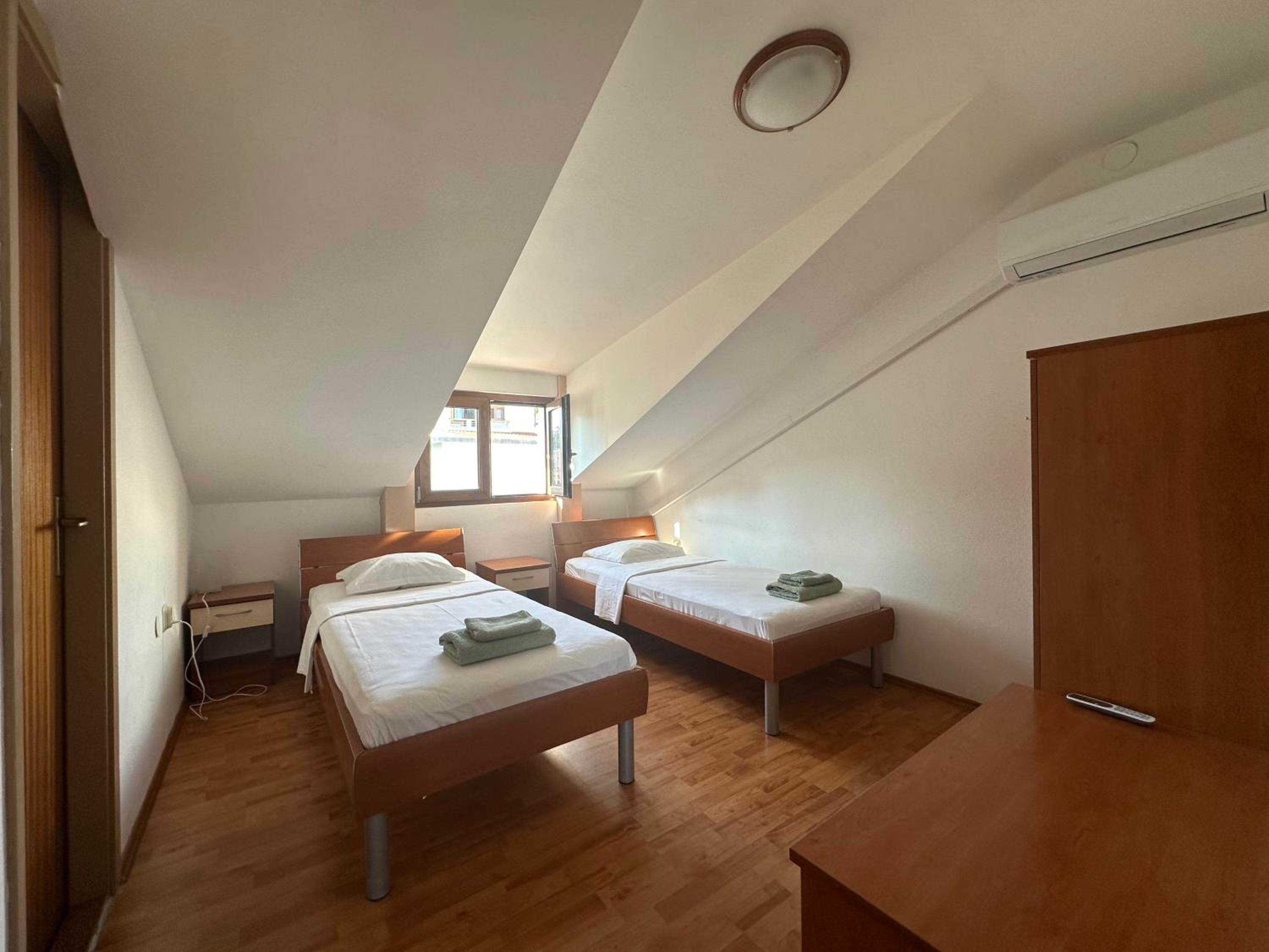 Four-Bedroom Apartment with Balcony 