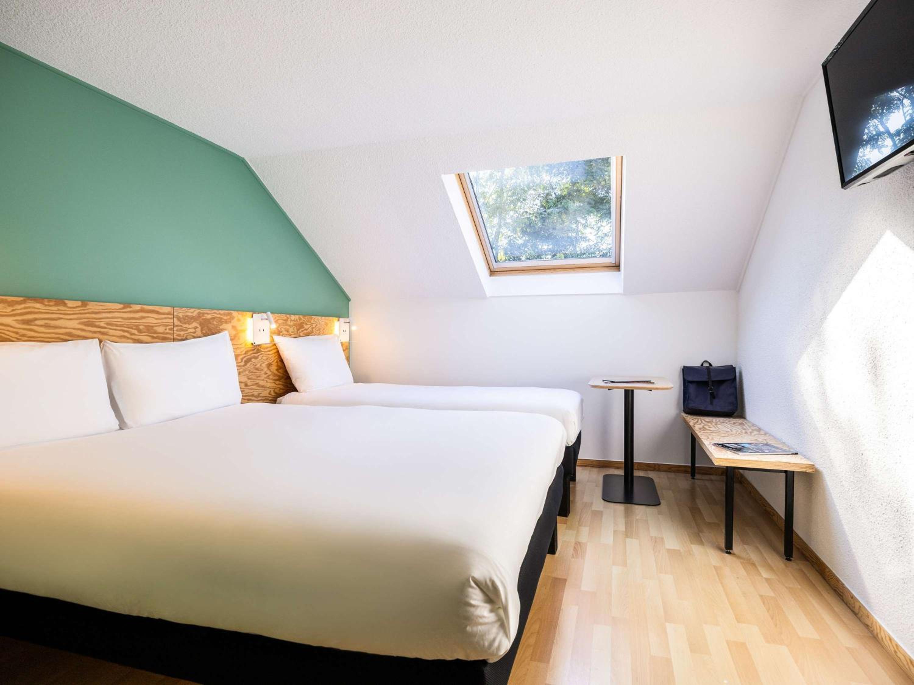 family room with one double and one single bed photo 3