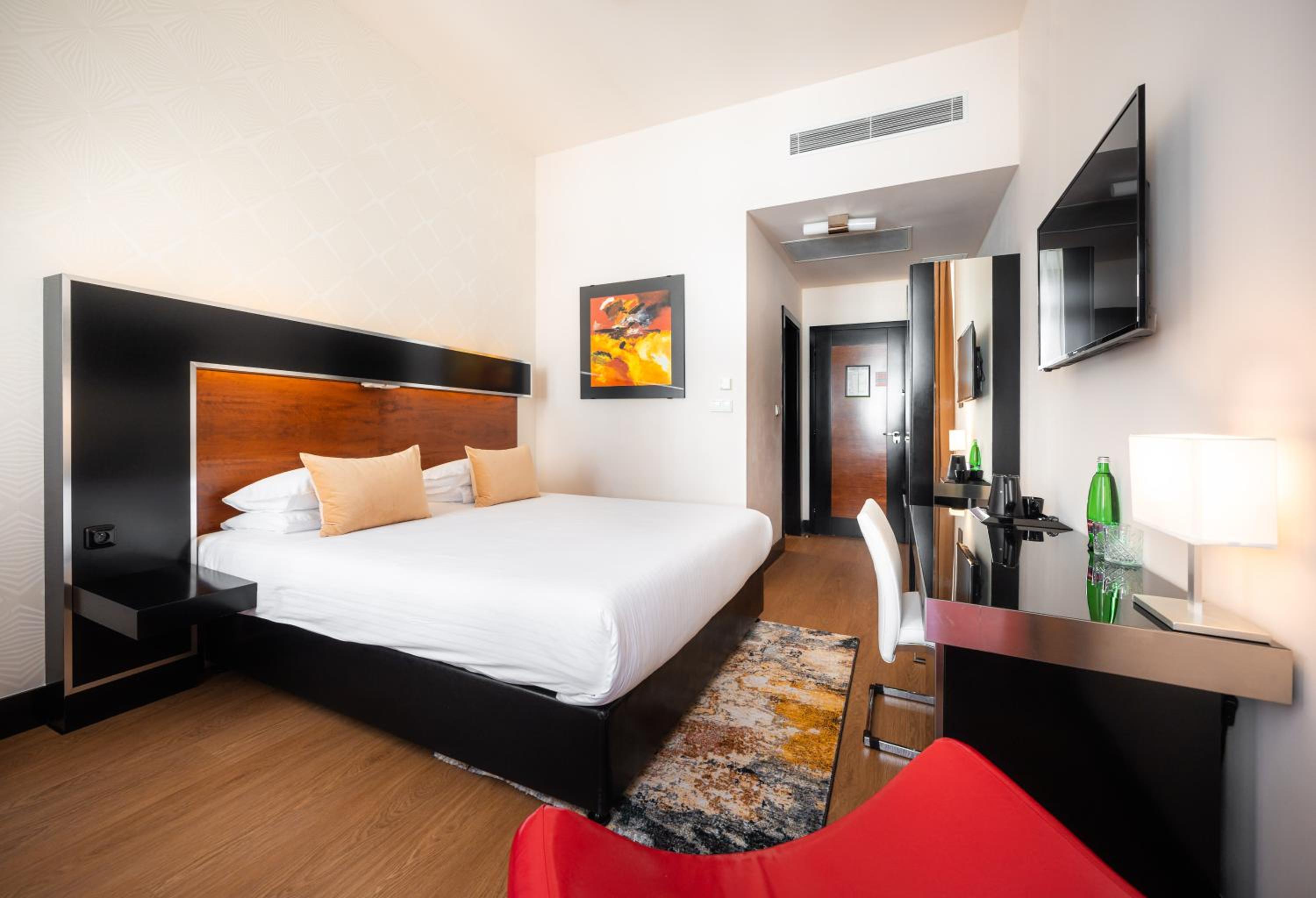 Relax in this stylish and cozy hotel room.