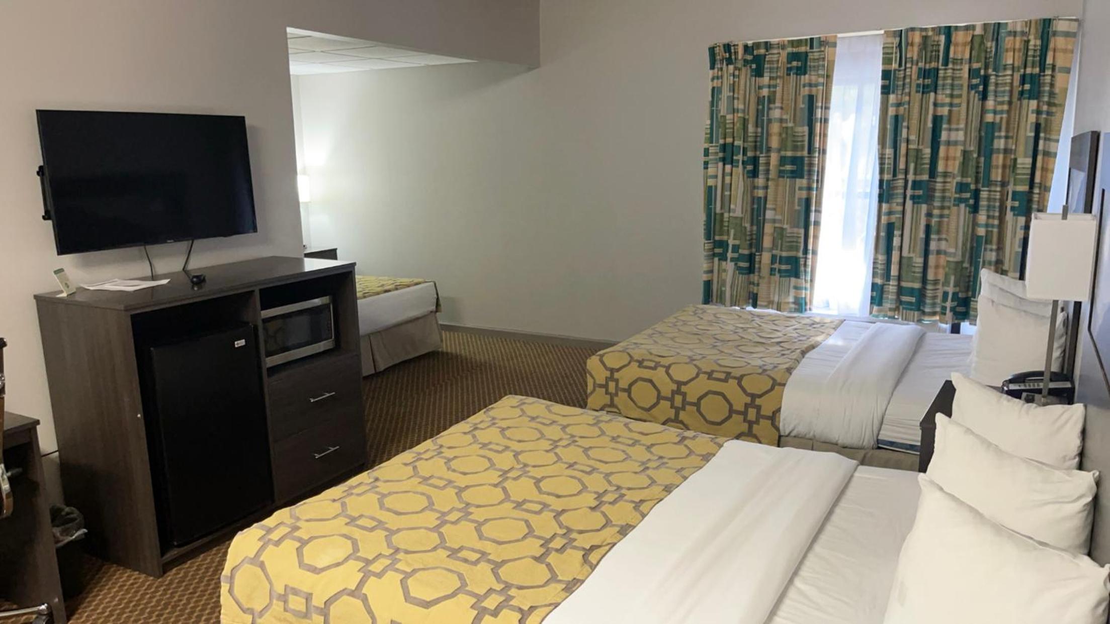 Deluxe Suite with Three Queen Beds - Non-Smoking photo 1