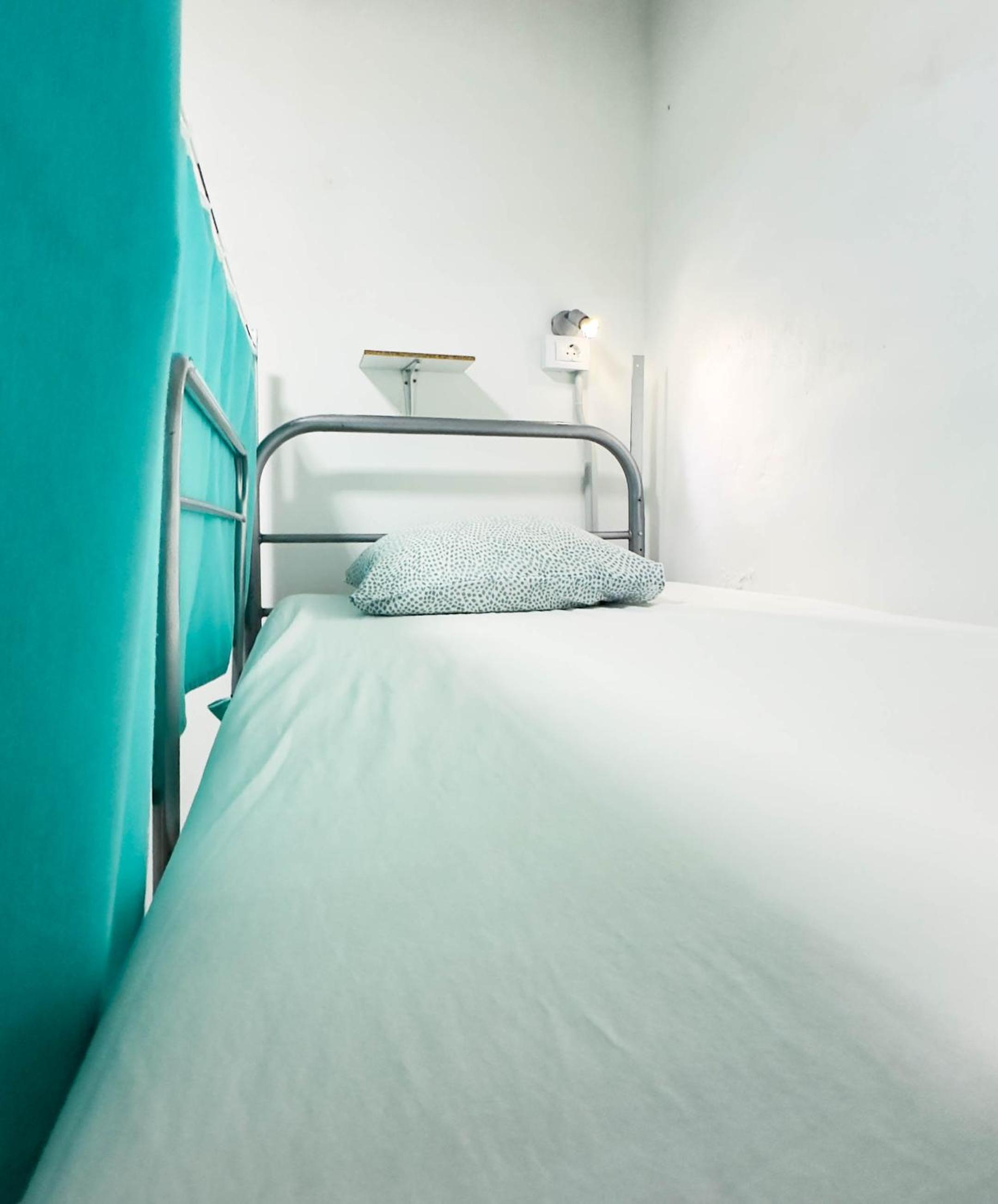 Cama en habitación compartida mixta para 8 huéspedes.
