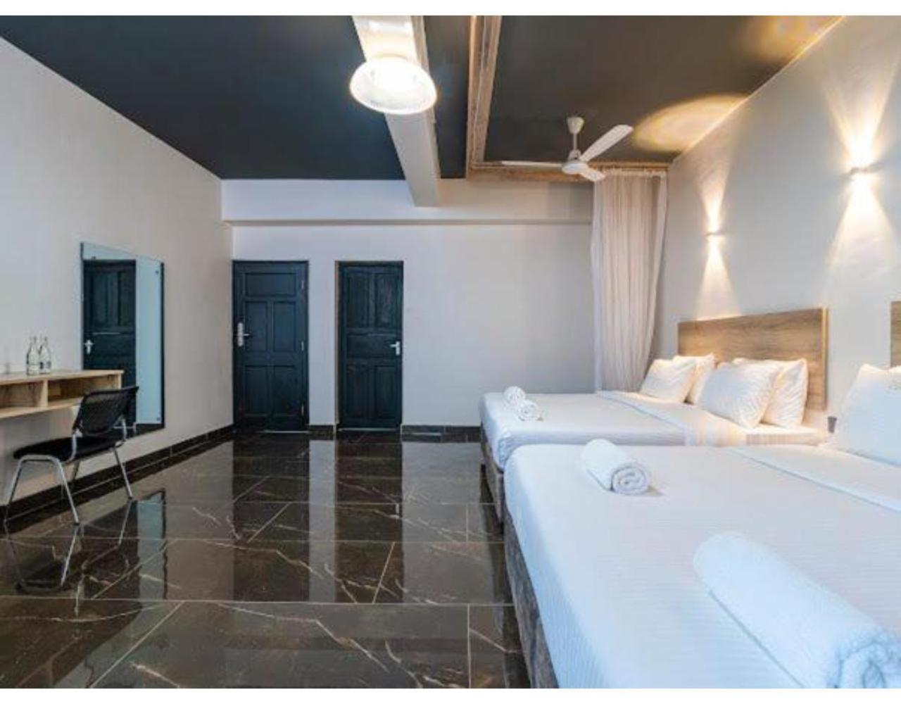 Deluxe Quadruple Room - Photo 14