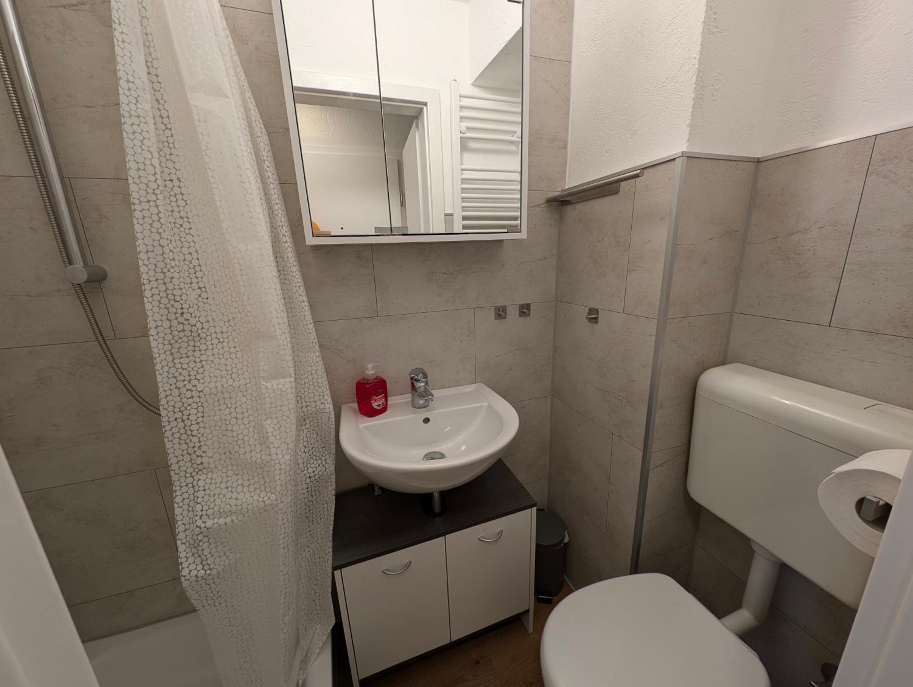 One-Bedroom Apartment with Balcony and City View photo 2