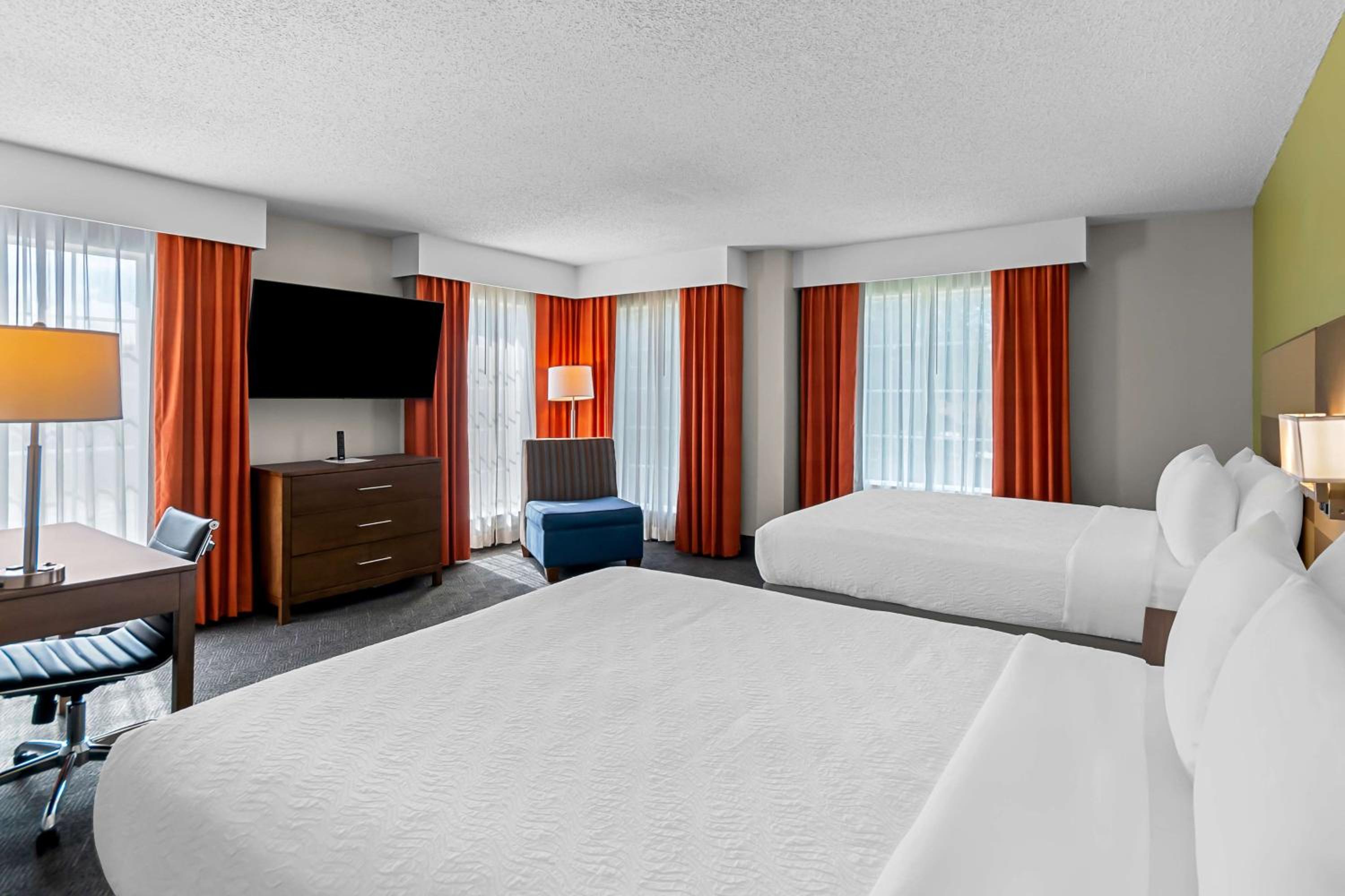 Queen Suite with Two Queen Beds and Sofa Bed - Photo 1
