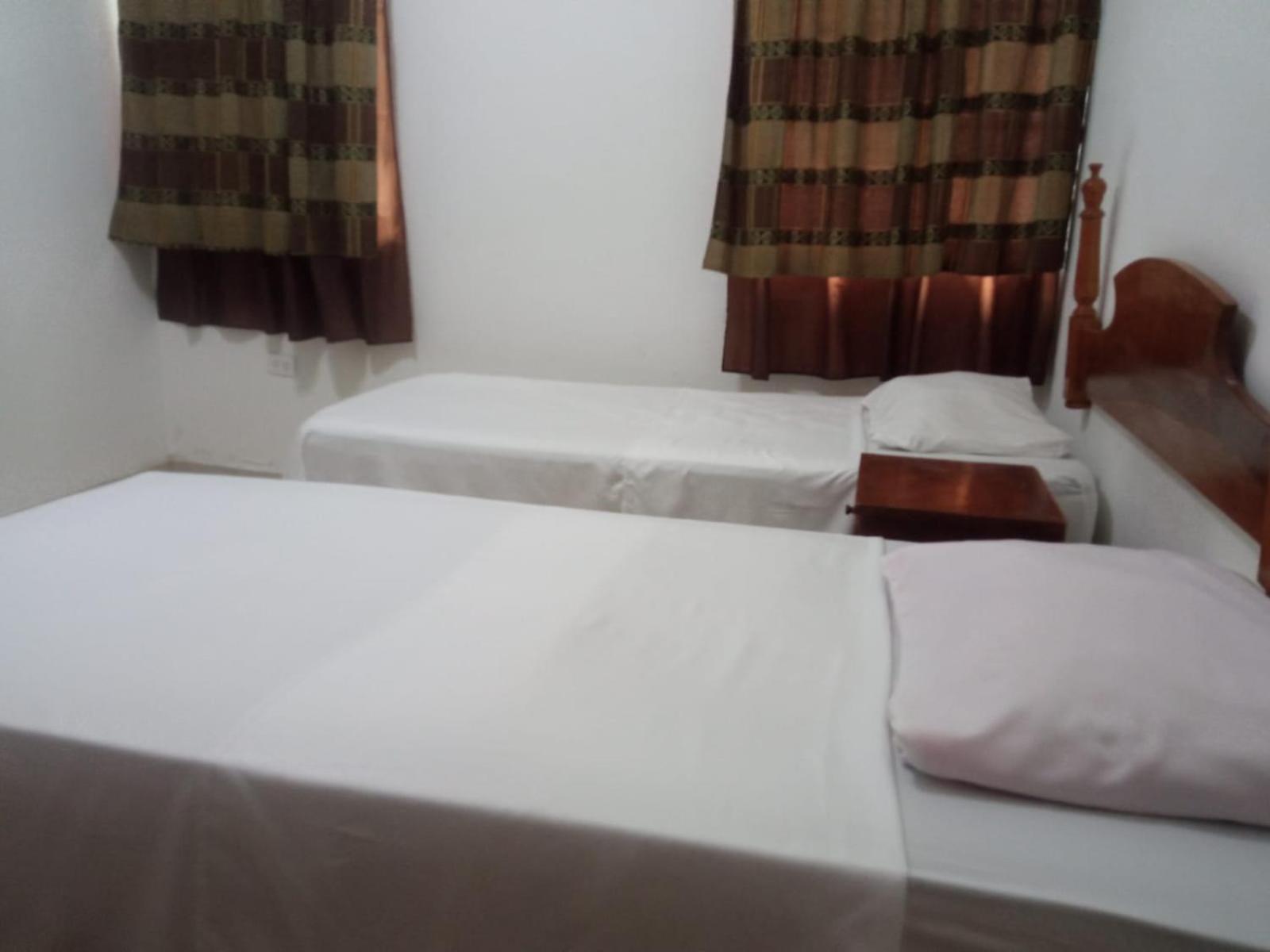 Single Bed In Dormitory Room