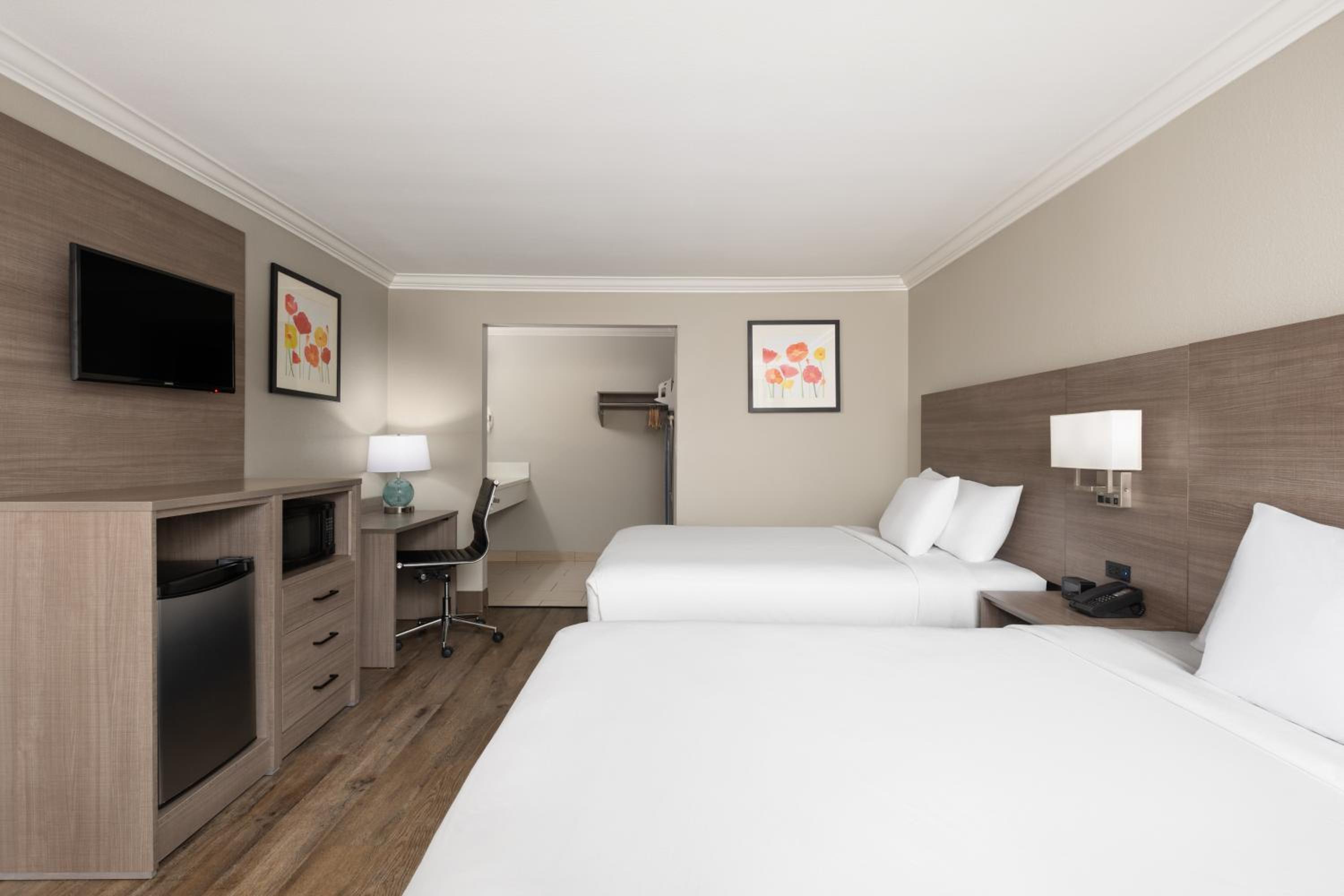Deluxe Queen Room with Two Queen Beds - Photo 1