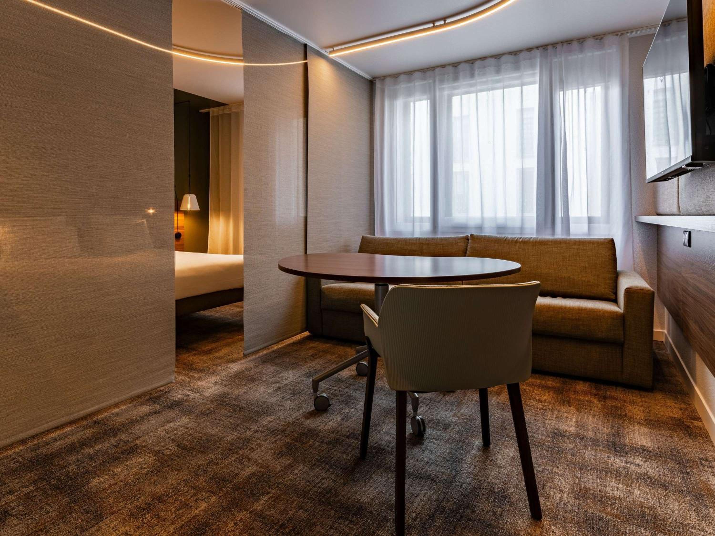 Executive Suite with One King Bed and Sofa that converts into 2 Single Beds - Photo 1