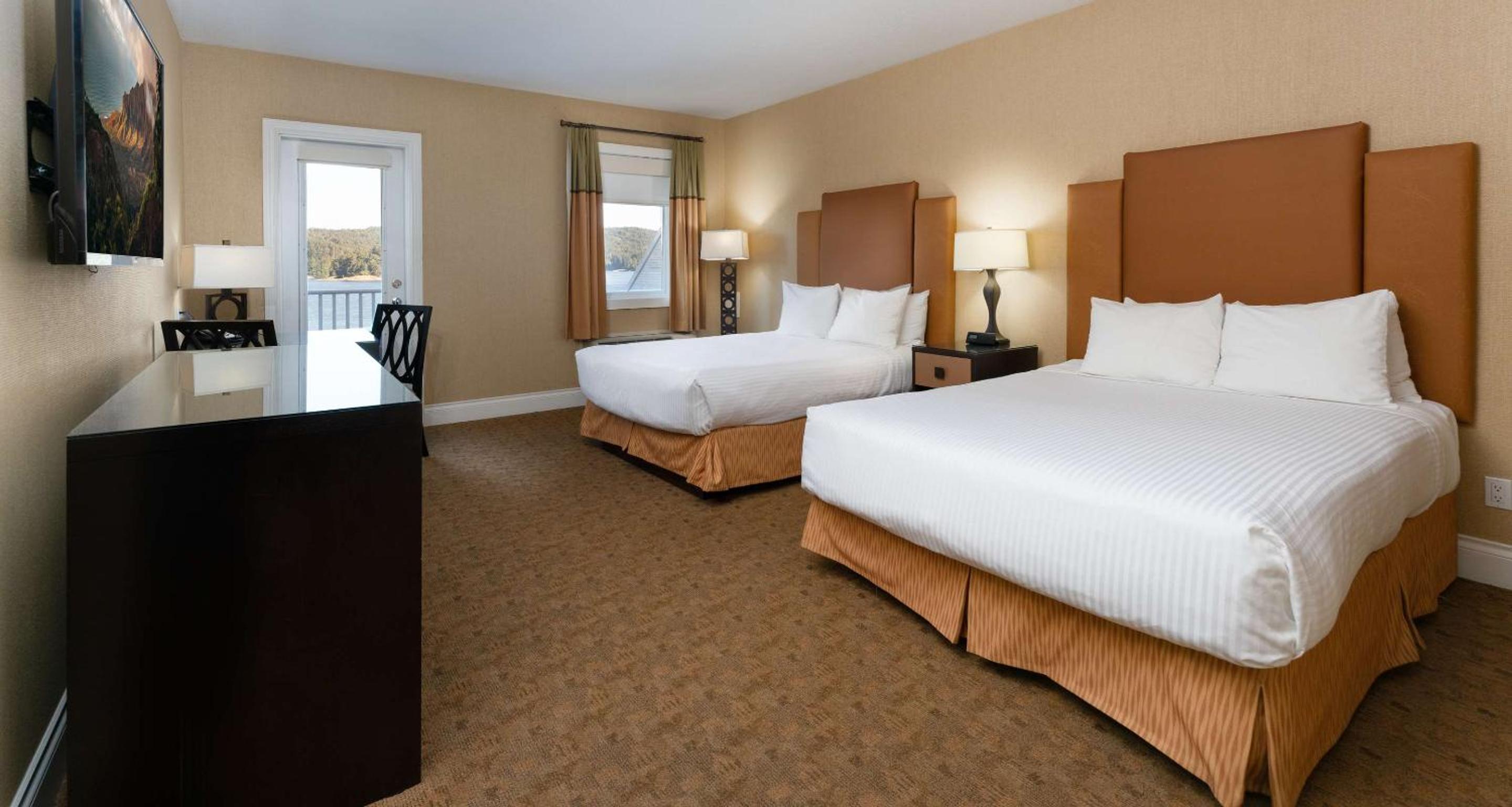 Queen Room with Two Queen Beds and Balcony - Partial Water View - Photo 1