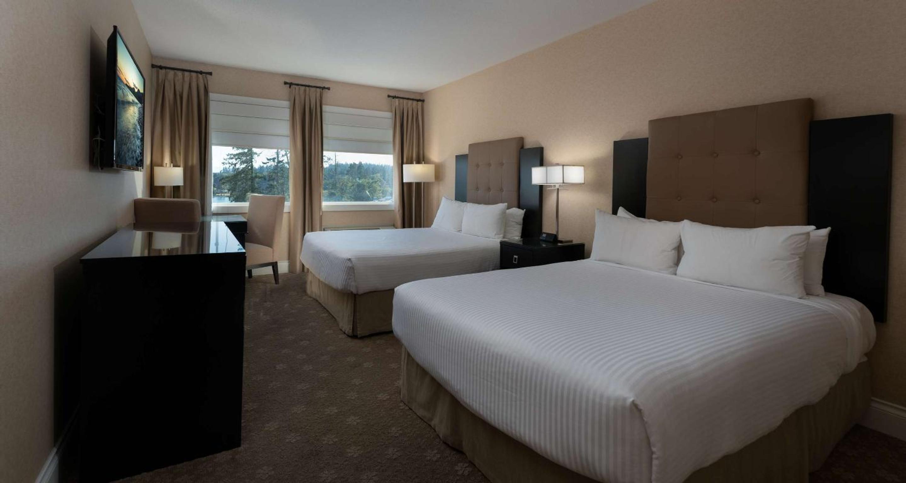 Queen Room with Two Queen Beds and Partial Water View - Photo 1