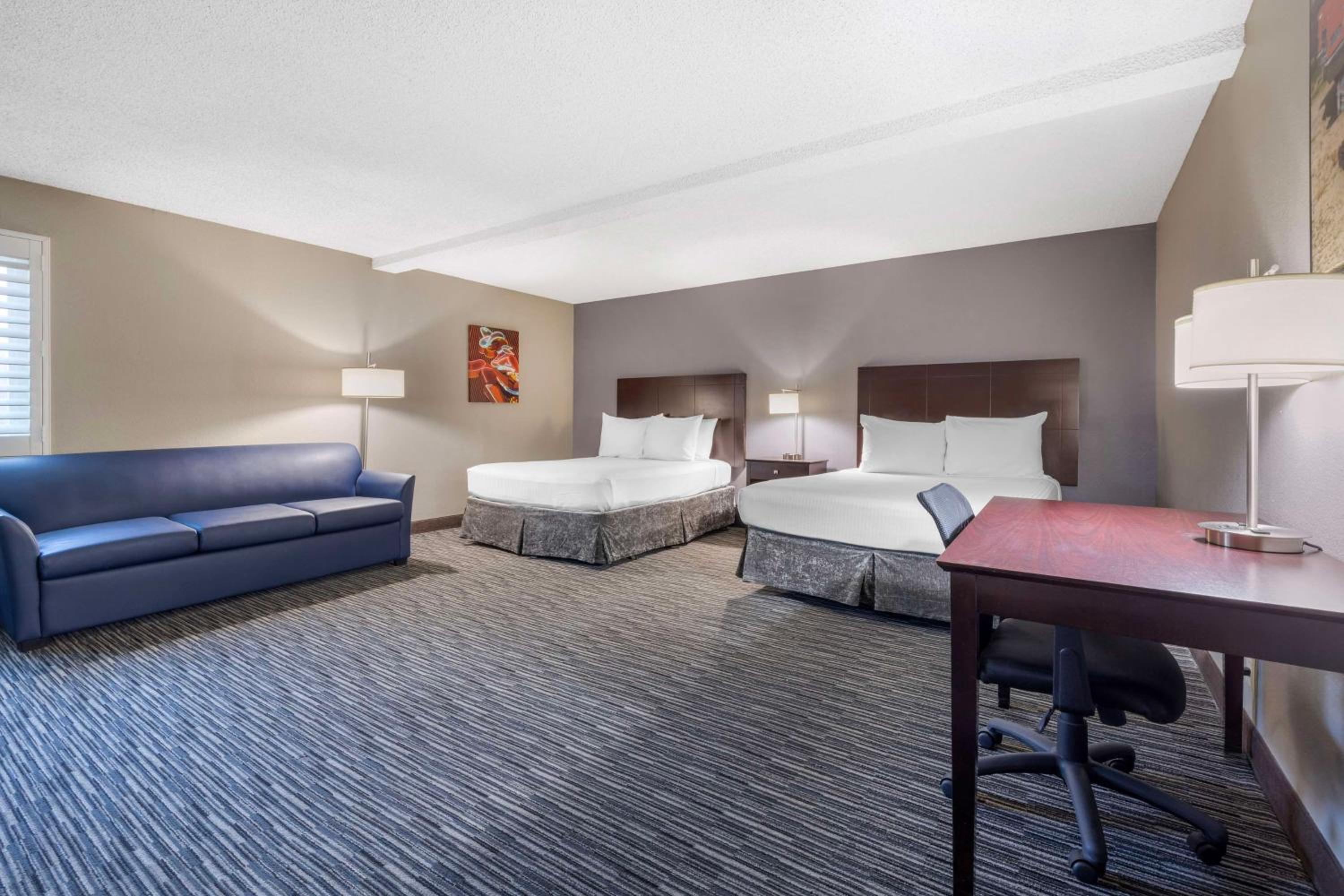 Queen Room with Two Queen Beds and Sofa Bed - Photo 1
