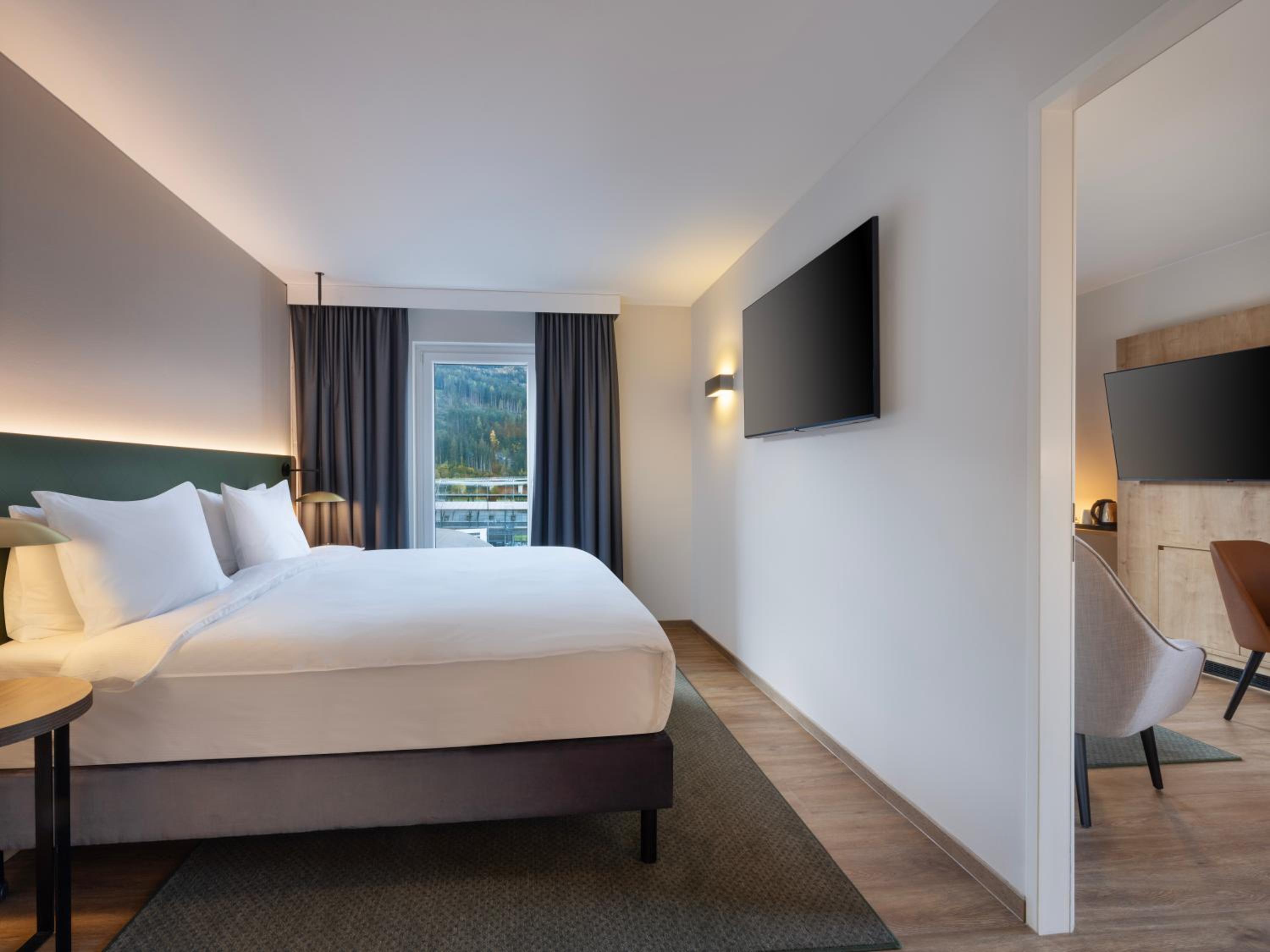 Deluxe King Corner Room with Sofa Bed - Photo 1