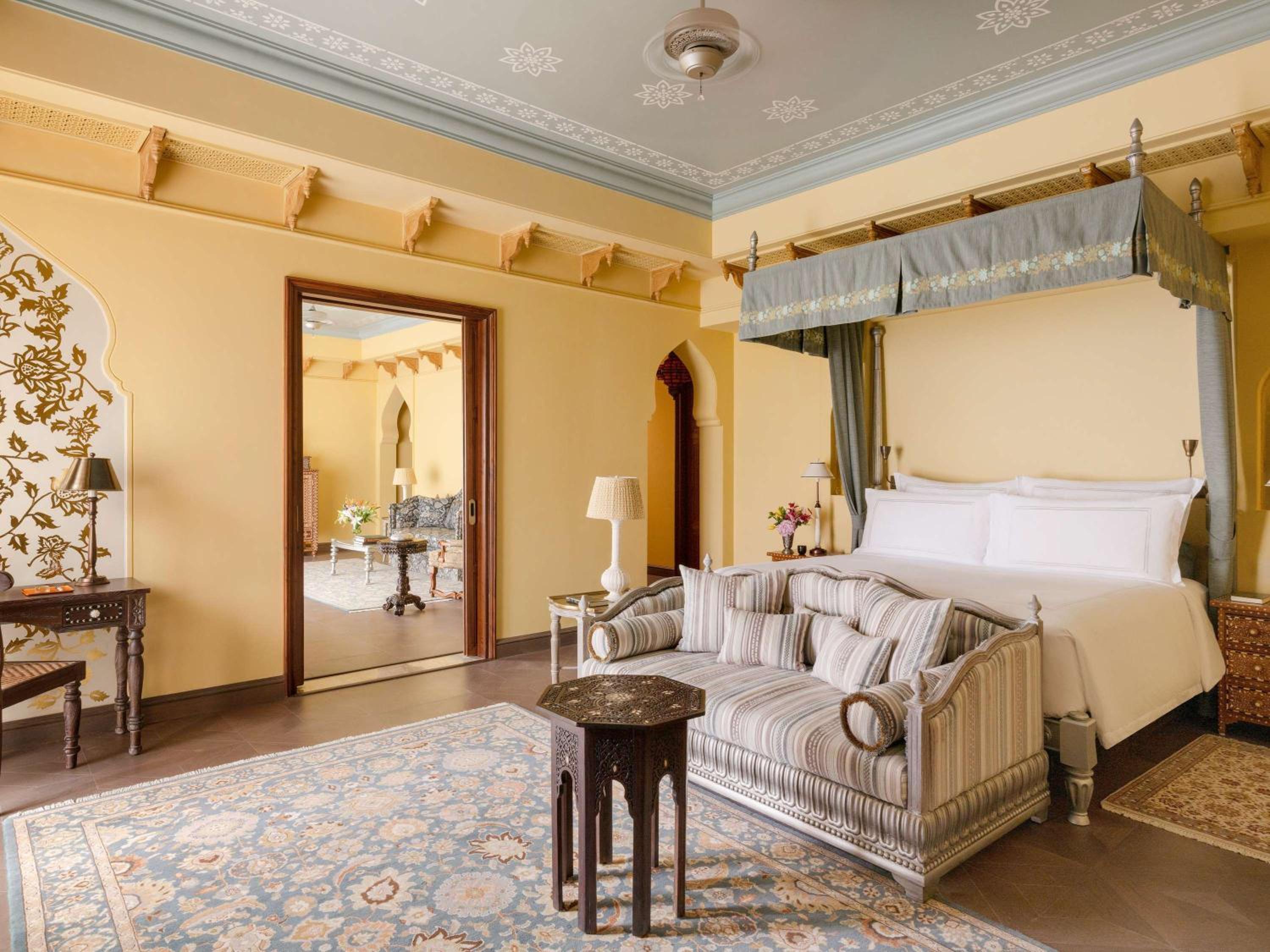 Maharani One King Bedroom Royal Suite with Pool: Airport Transfers in luxury vehicle, 01 Bottle of wine, INR 5000 hotel credit once during the stay. One 60-minute couple spa therapy. Evening Hi-Tea / Sundowner with Bartender, Butler Service