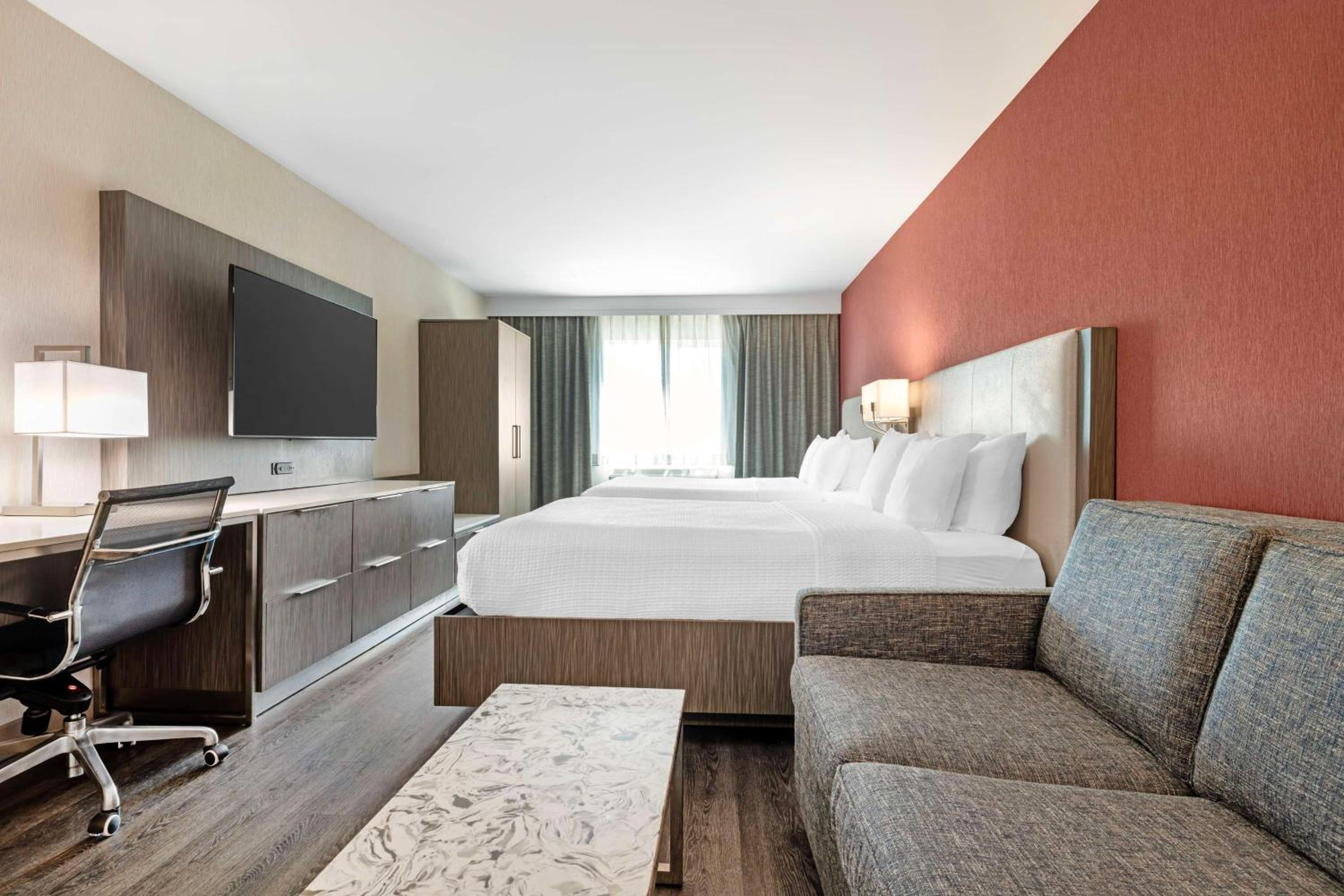Queen Room with Two Queen Beds and Sofa Bed - Non-Smoking photo 3