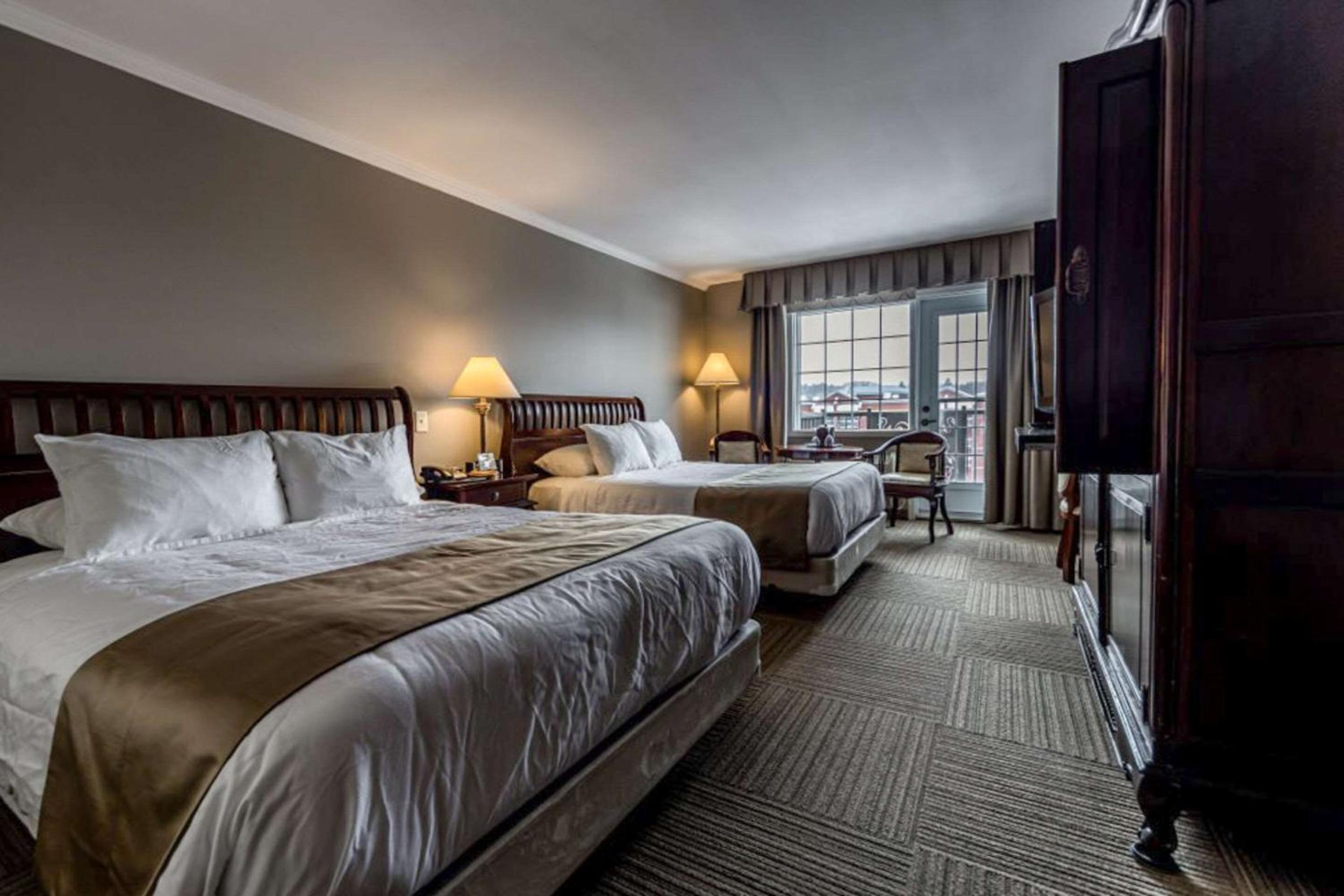 Superior Two Queen Beds with Partial Lake View - Photo 1