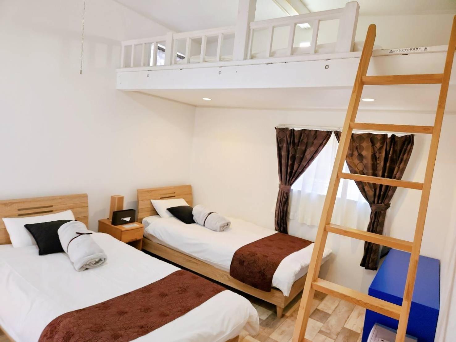 Twin Room with Loft Beds and Sofa Bed