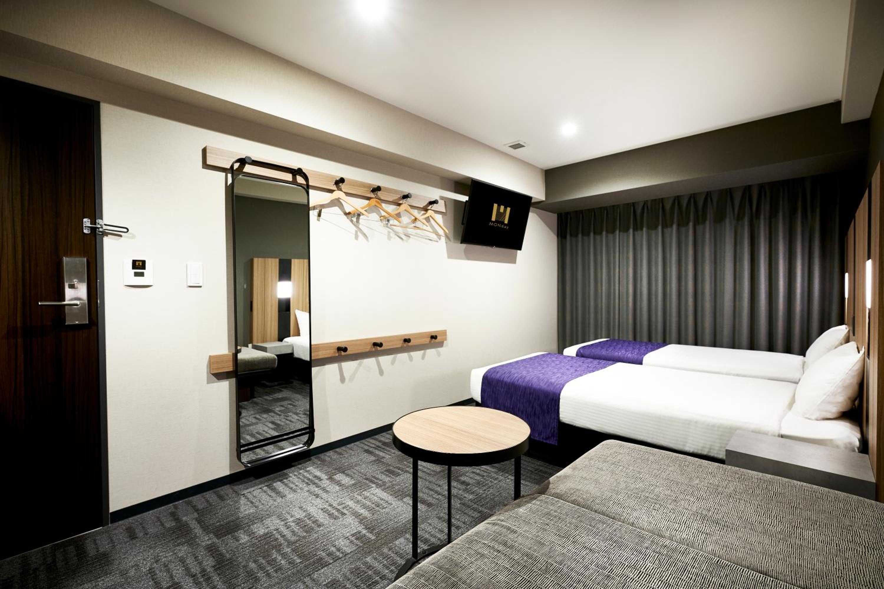 Deluxe Twin Room with Sofa Bed and Bath Tub - Photo 9