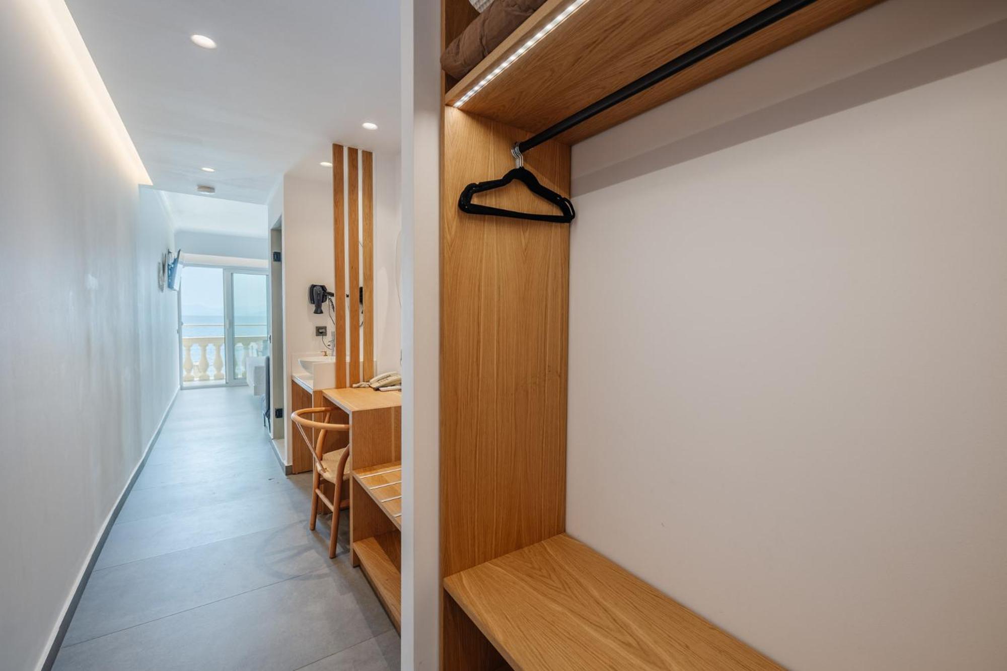 Deluxe Triple Suite with balcony and Pontikonisi island view