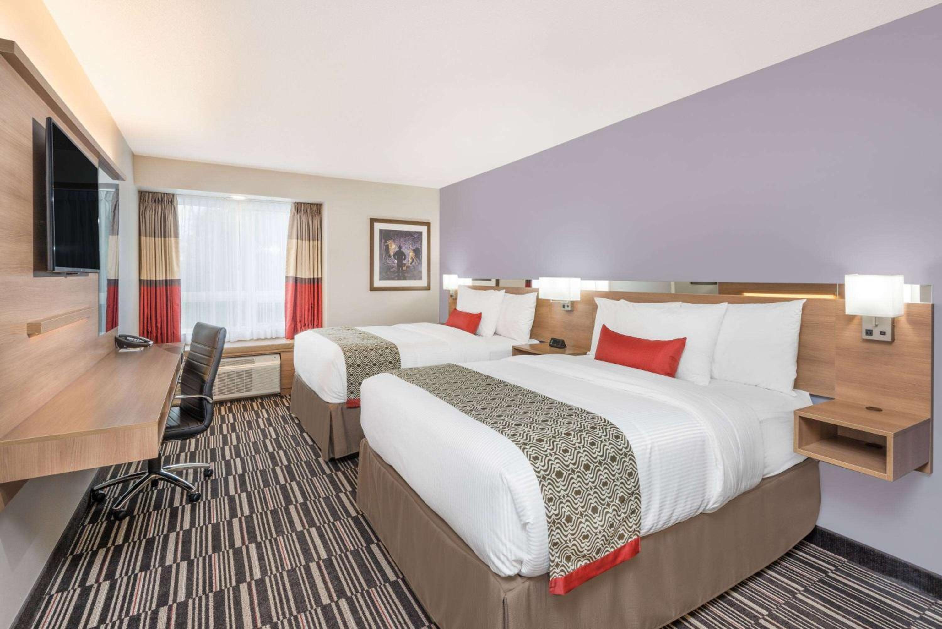 Queen Room with Two Queen Beds and Shower Only - Non-Smoking photo 1