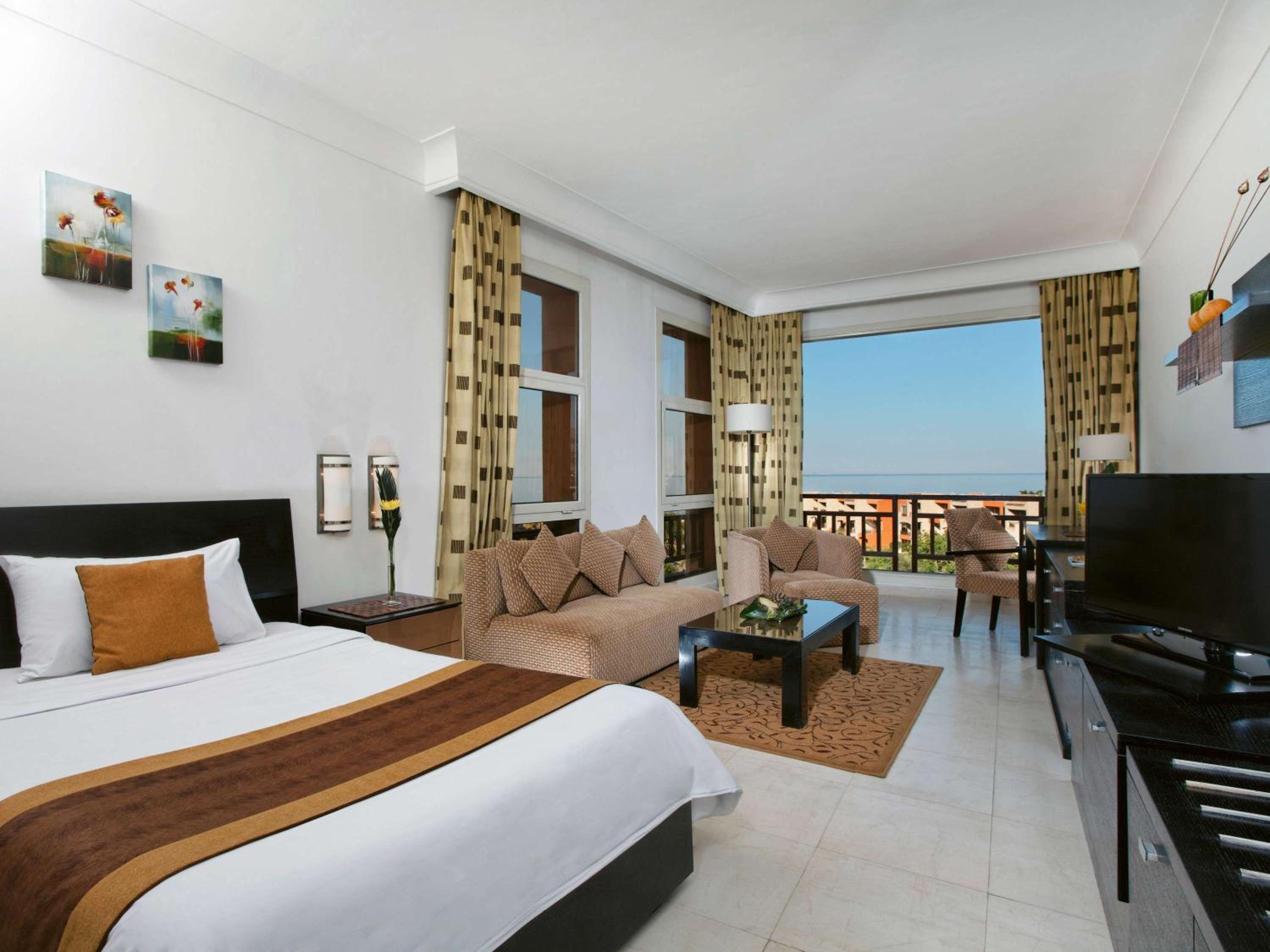 Deluxe King Room with Partial Sea View - Photo 1