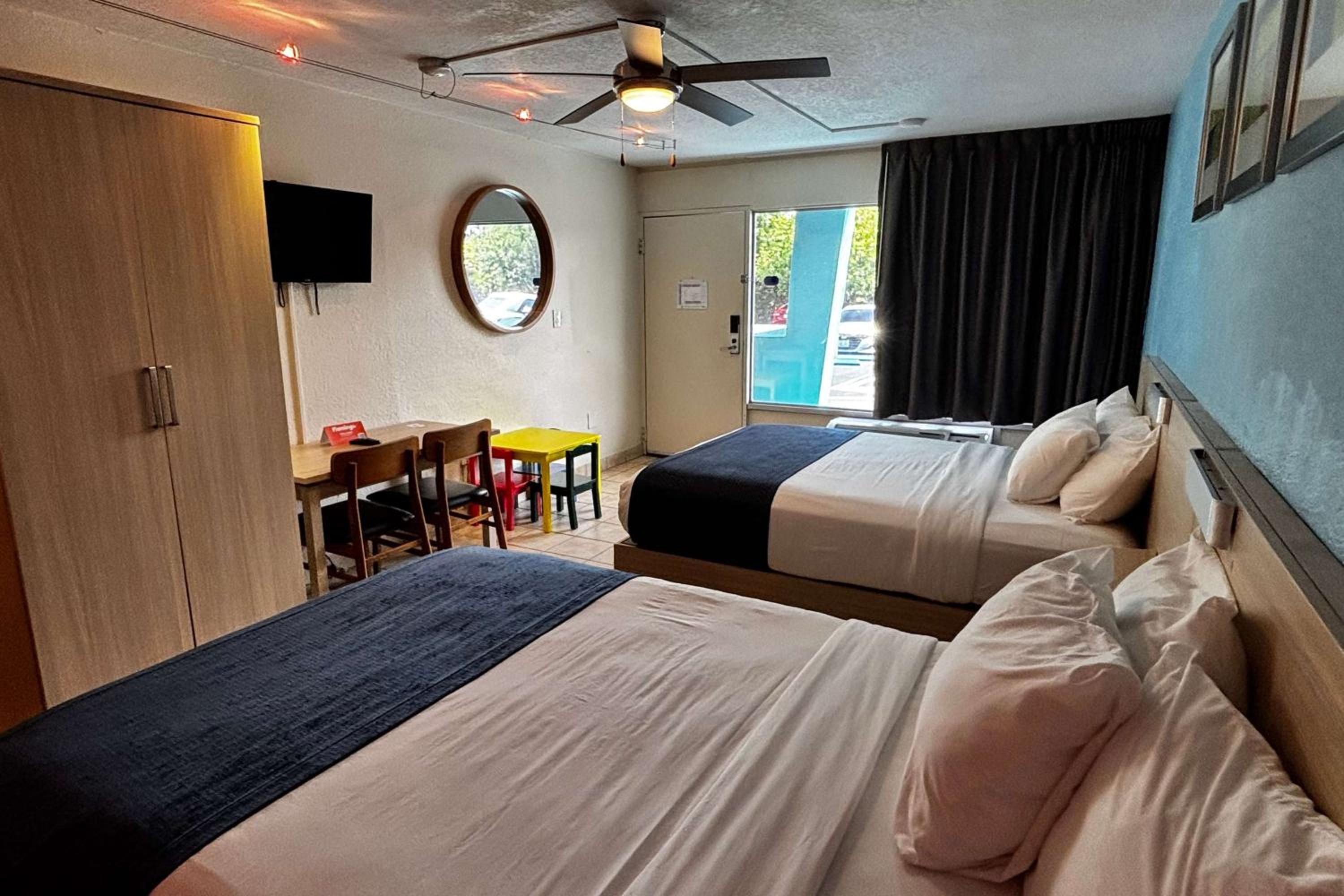 Room with Two Queen Beds and Mobility/Hearing Access and Roll-In Shower, Non-Smoking at Ramada by Wyndham Flamingo Water Park in Kissimmee