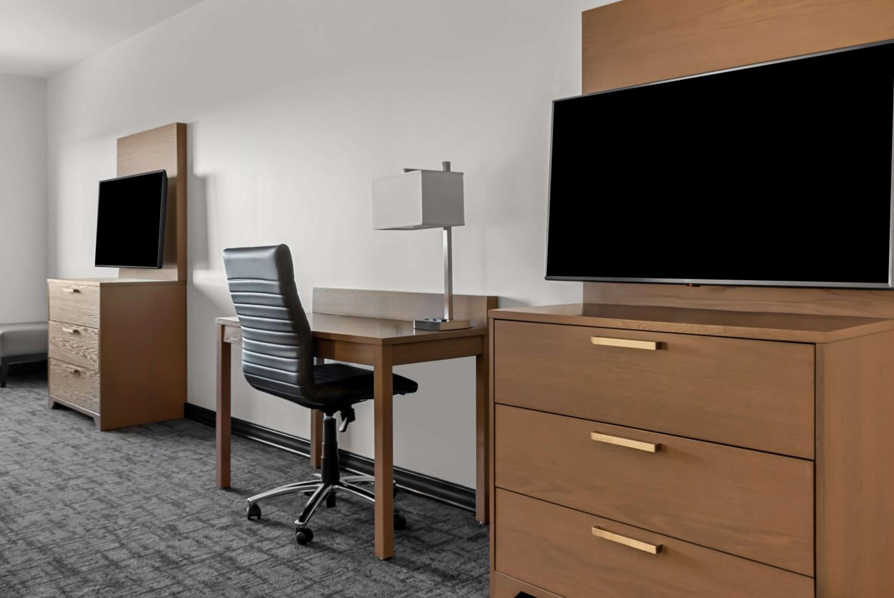 Queen Suite with Three Queen Beds and Sofa Bed - Non-Smoking - Photo 1