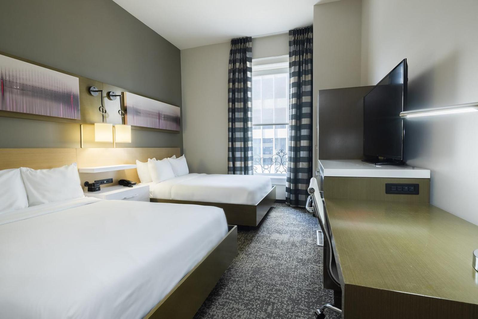Deluxe Queen Room With Two Queen Beds photo 2