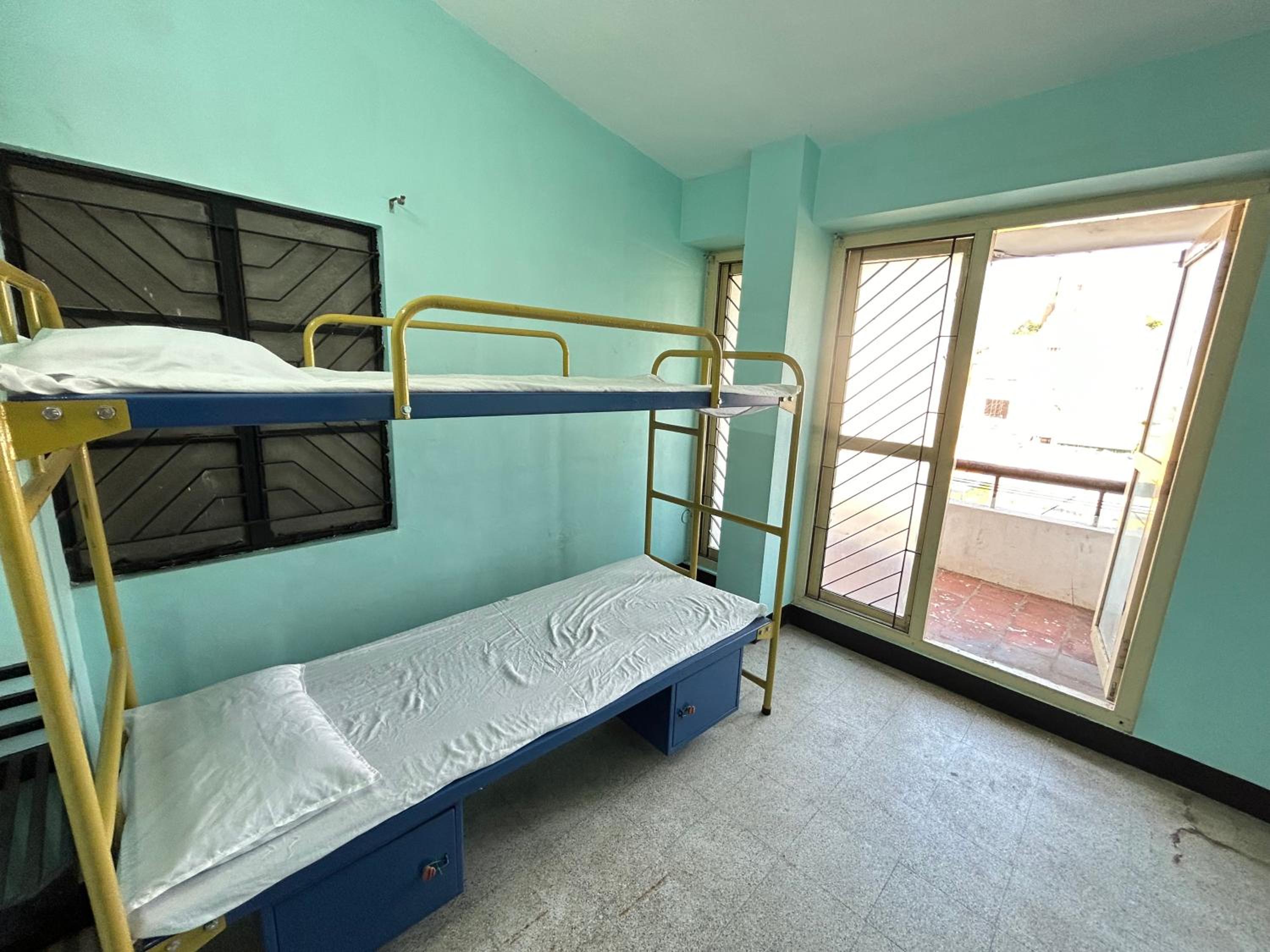 Single Bed In Dormitory Room photo 1