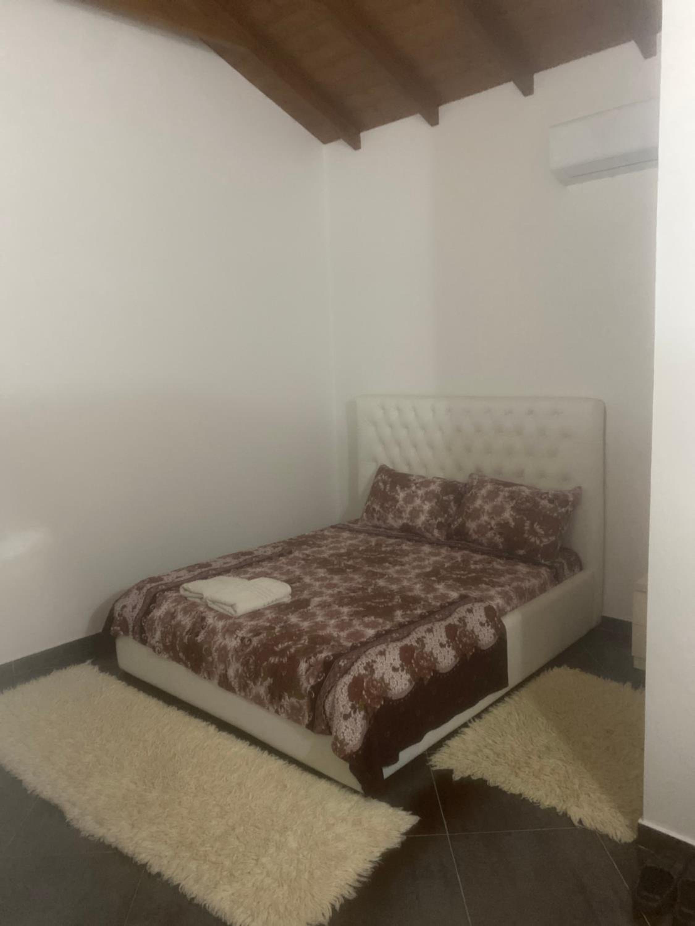 Single Bed In Dormitory Room