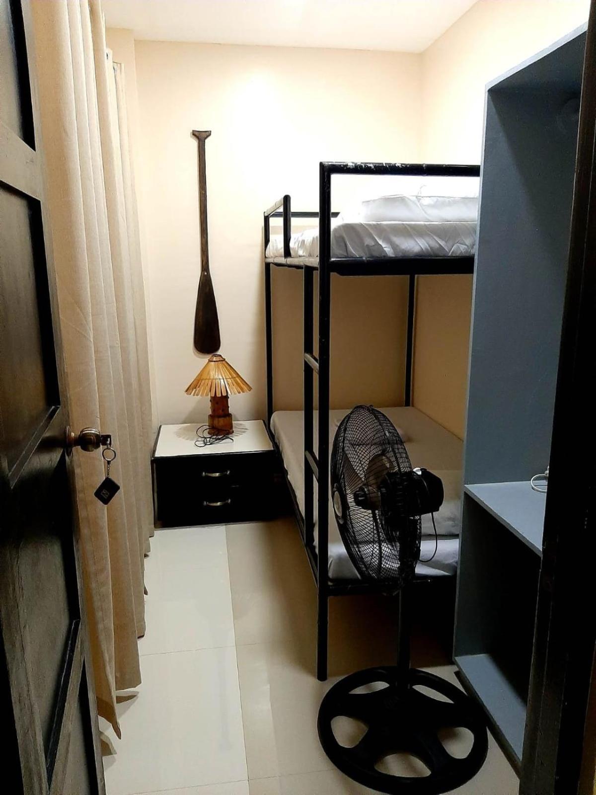 Fan Room With Bunk Bed And Shared Bathroom