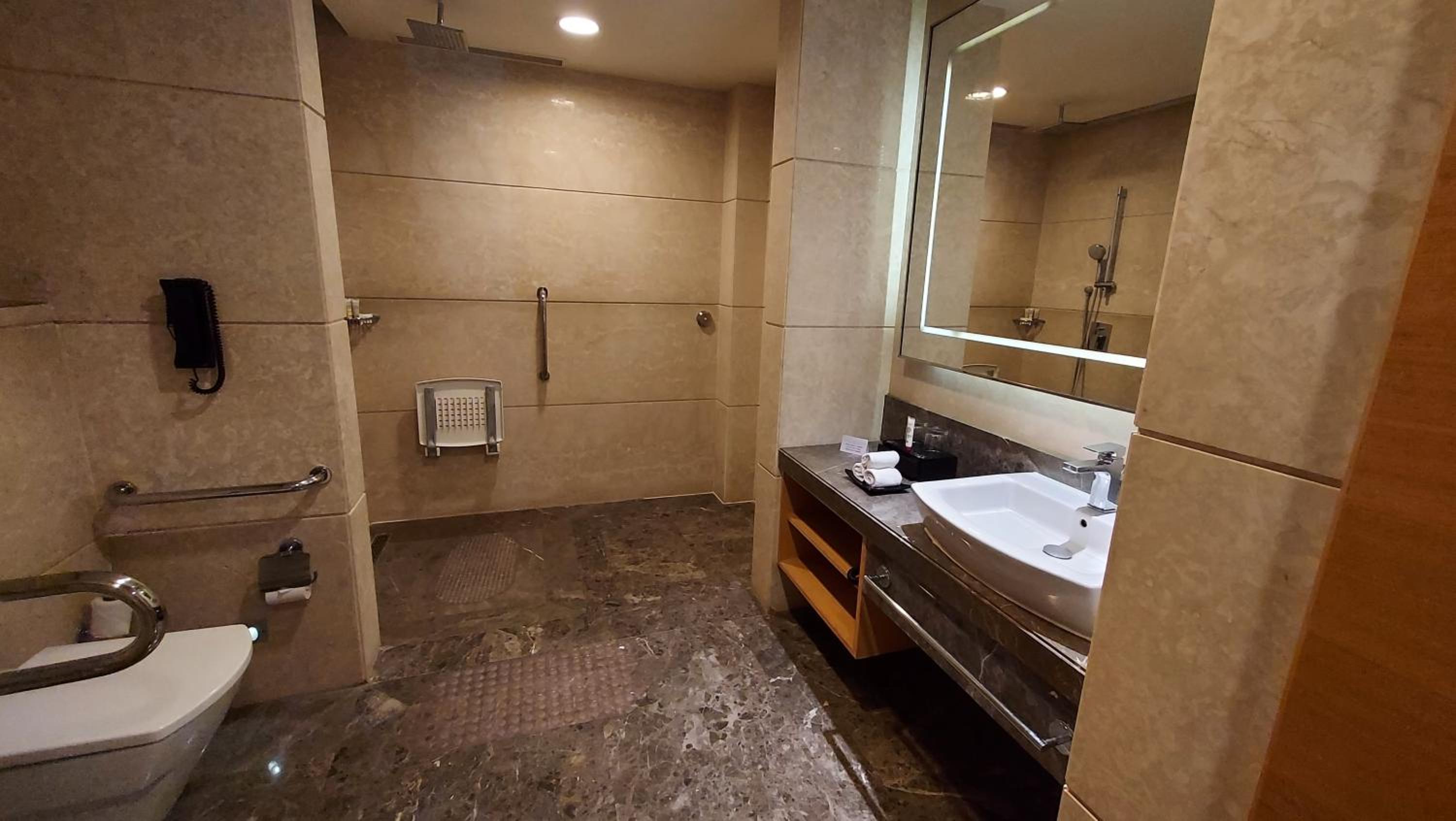 Classic King Room with Pool View - Disability Access: 20% off on food,soft beverages, laundry & local transportation(upto 10 km); enjoy 90-min spa at 60mins spa price; BOGO offer on select beverages(5–8 pm) at Connexions Bar