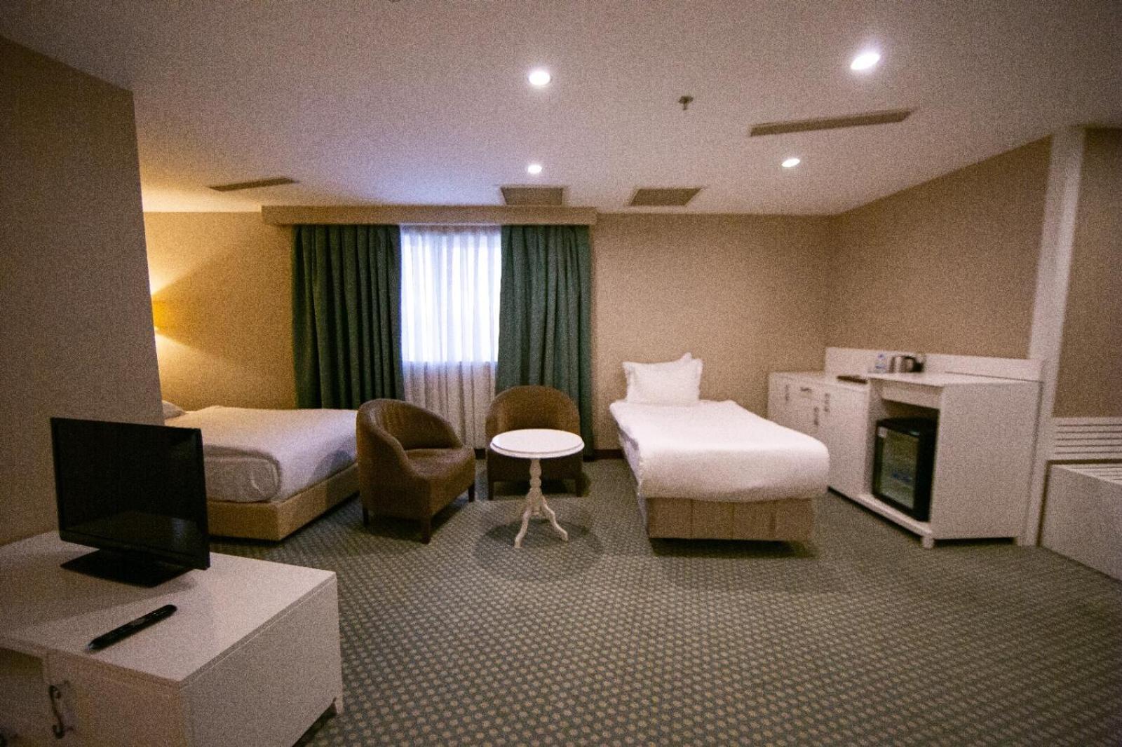 Deluxe Triple Room - Photo 12