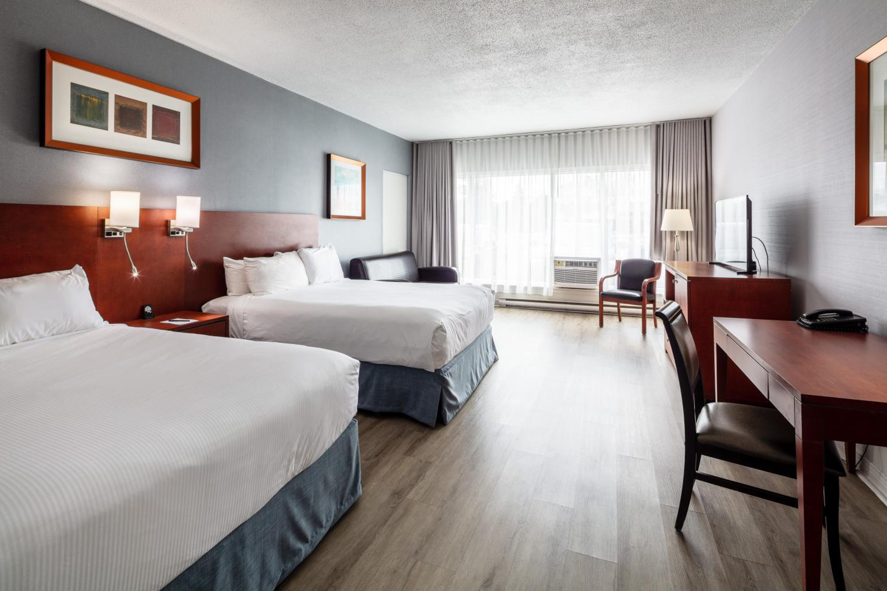 Deluxe Queen Room with Two Queen Beds - Photo 1