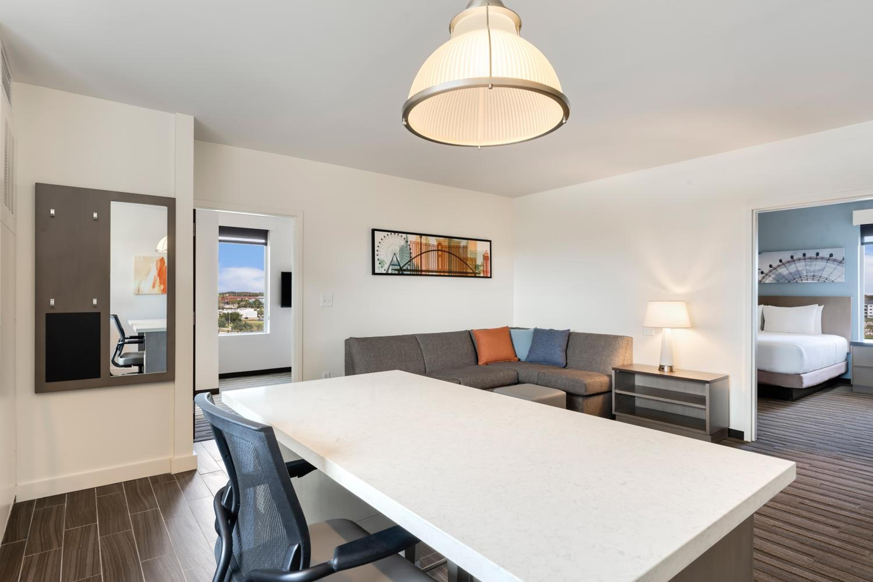 Two-Bedroom Suite with One King and Two Queen Beds with Kitchen and Sofa Bed