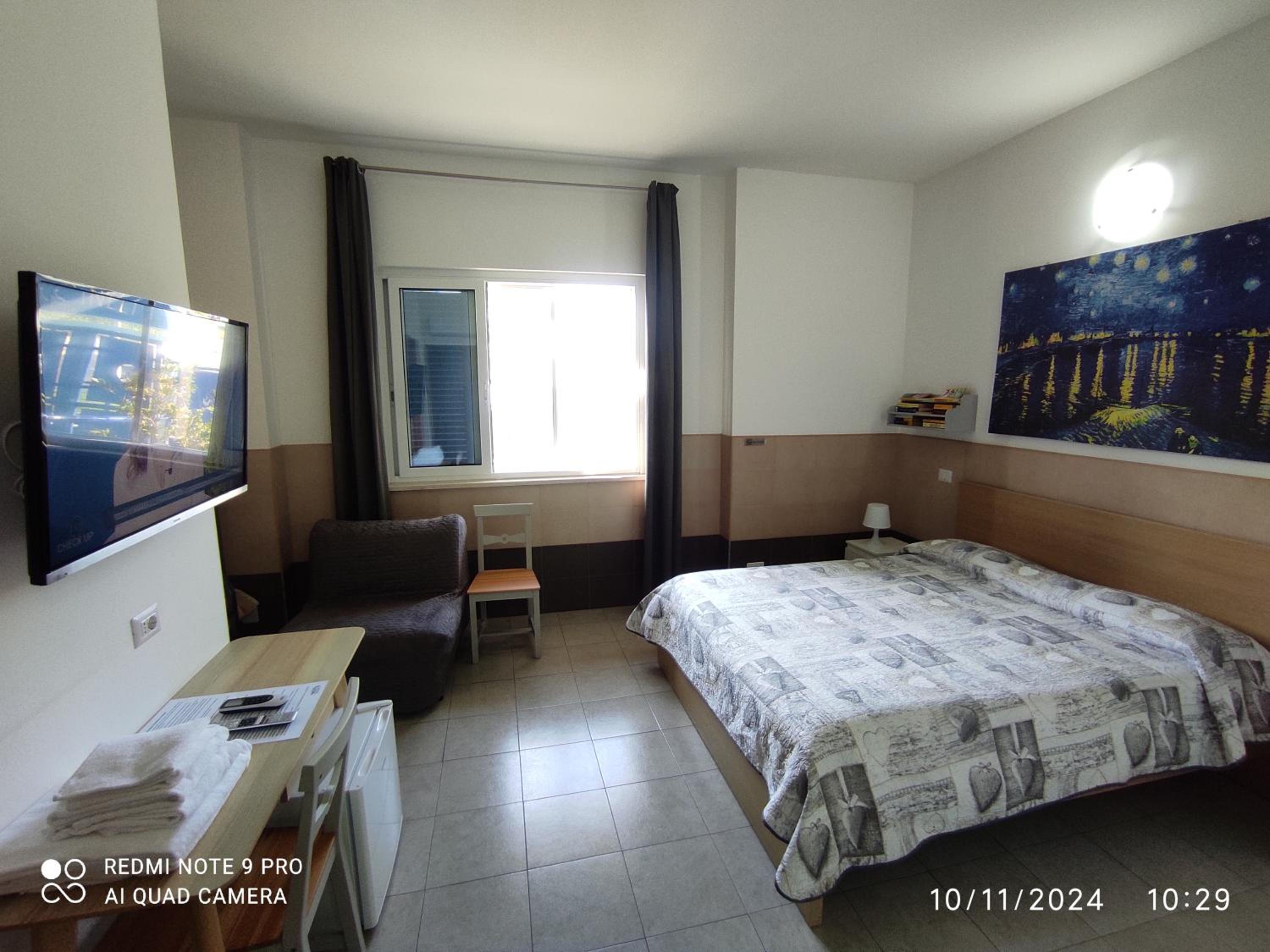 Quadruple Room with Private Bathroom photo 1