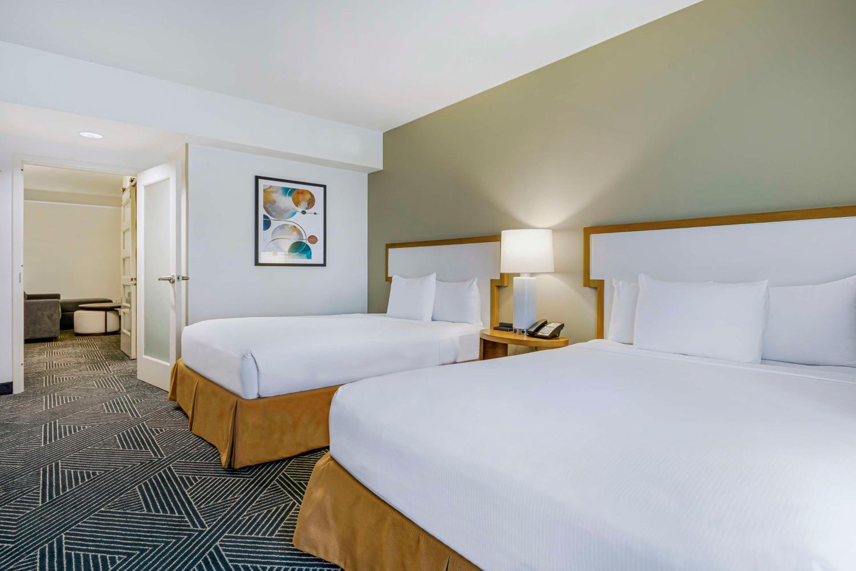 Corner Queen Suite with Two Queen Beds and Bath Tub - Mobility/Hearing Accessible photo 1