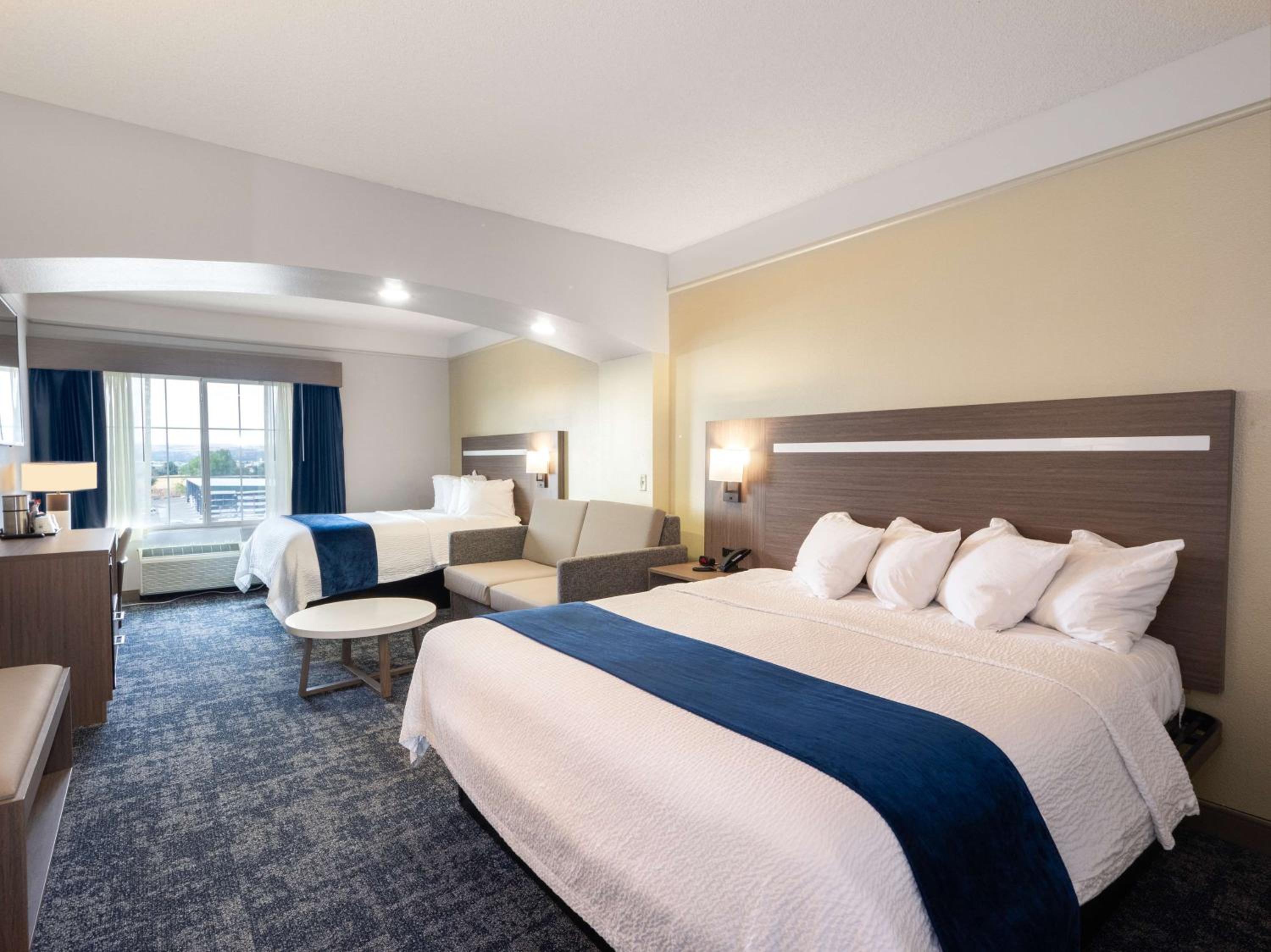 Larger Room with One King and One Queen Bed and Sofa - Non-Smoking - Photo 3
