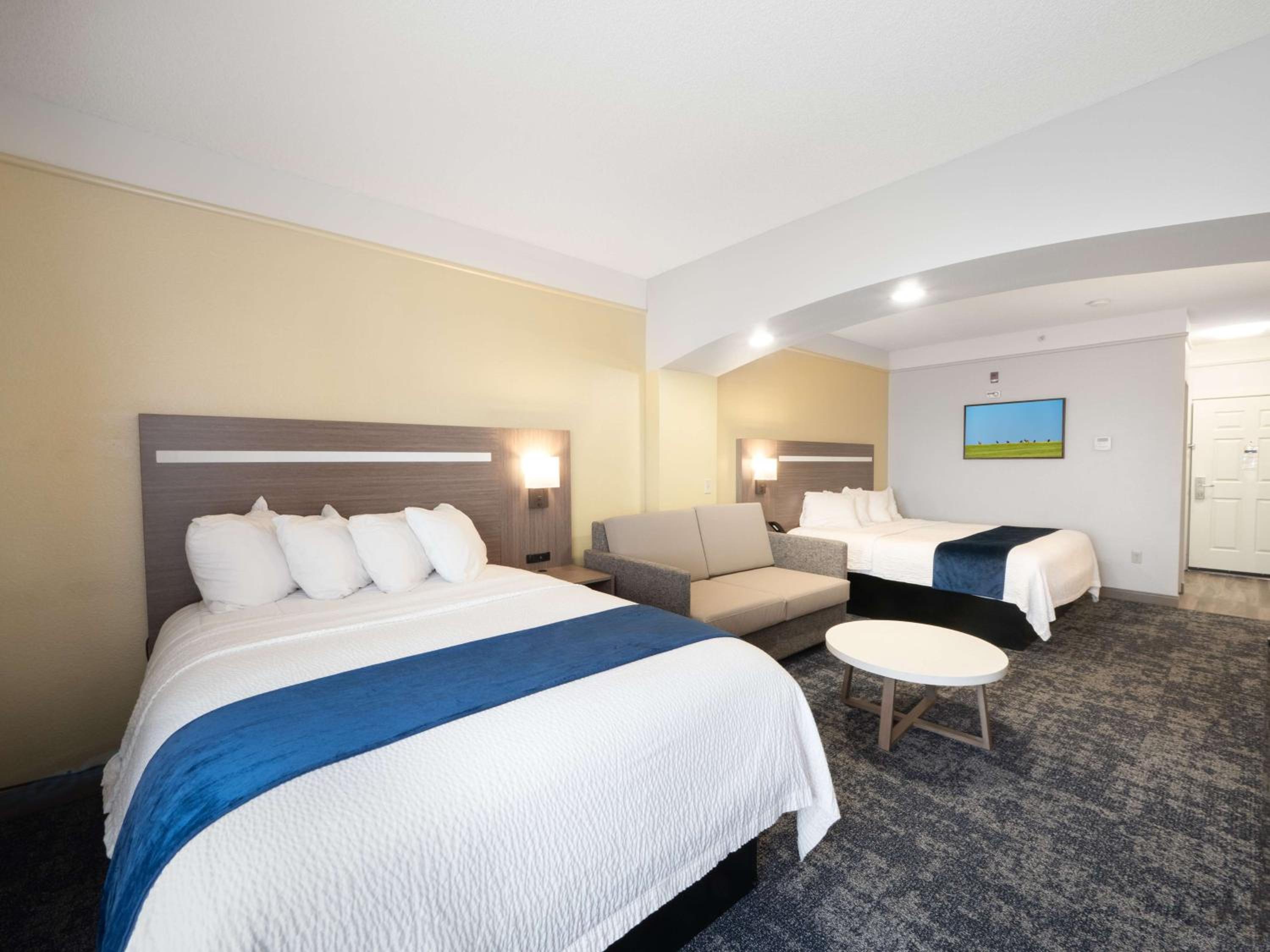 Larger Room with One King and One Queen Bed and Sofa - Non-Smoking - Photo 4