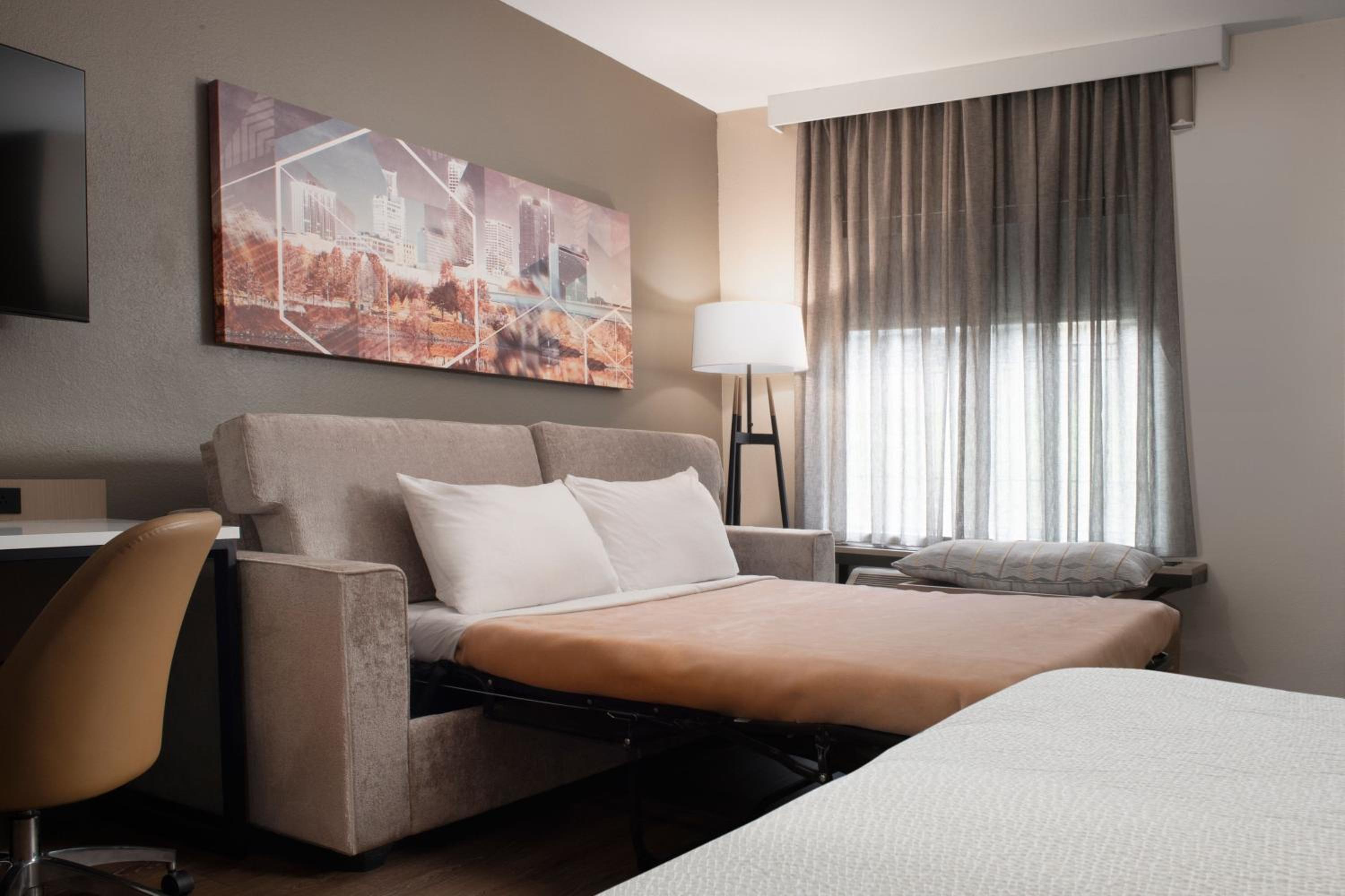 Queen Suite with Two Queen Beds and Sofa Bed - Photo 2