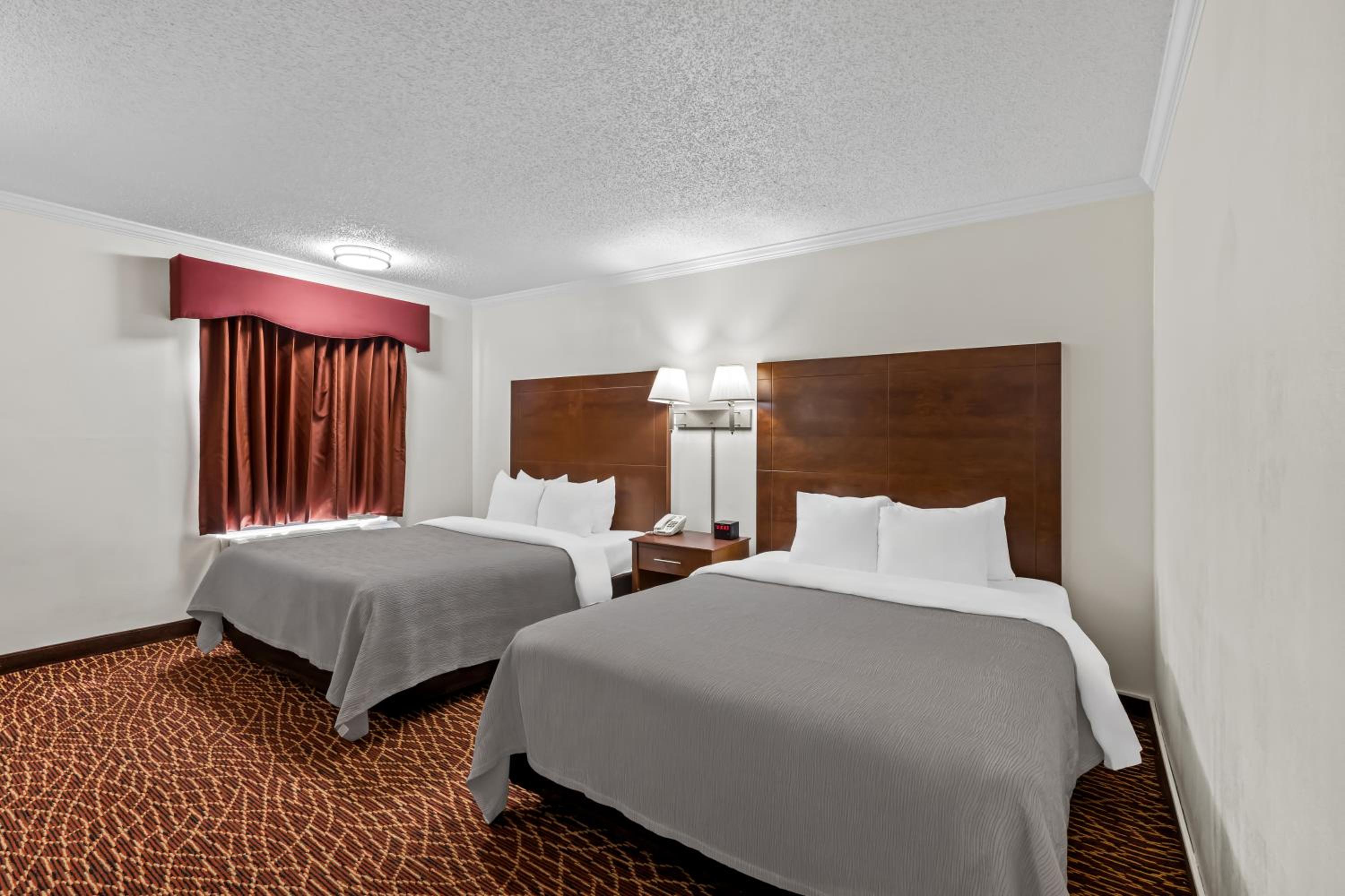 Quadruple Room with Two Queen Beds - Smoking/Interior Hall/Pet Friendly photo 2