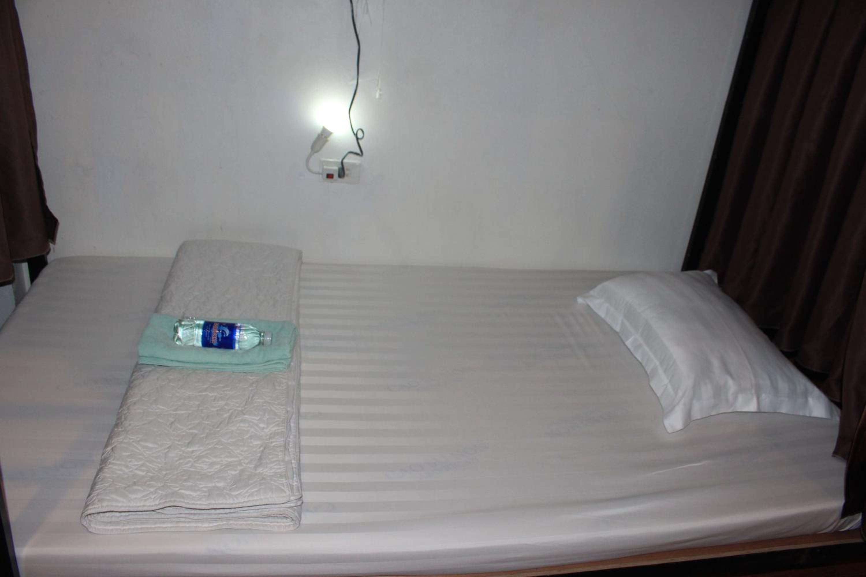 Single Bed in Dormitory Room