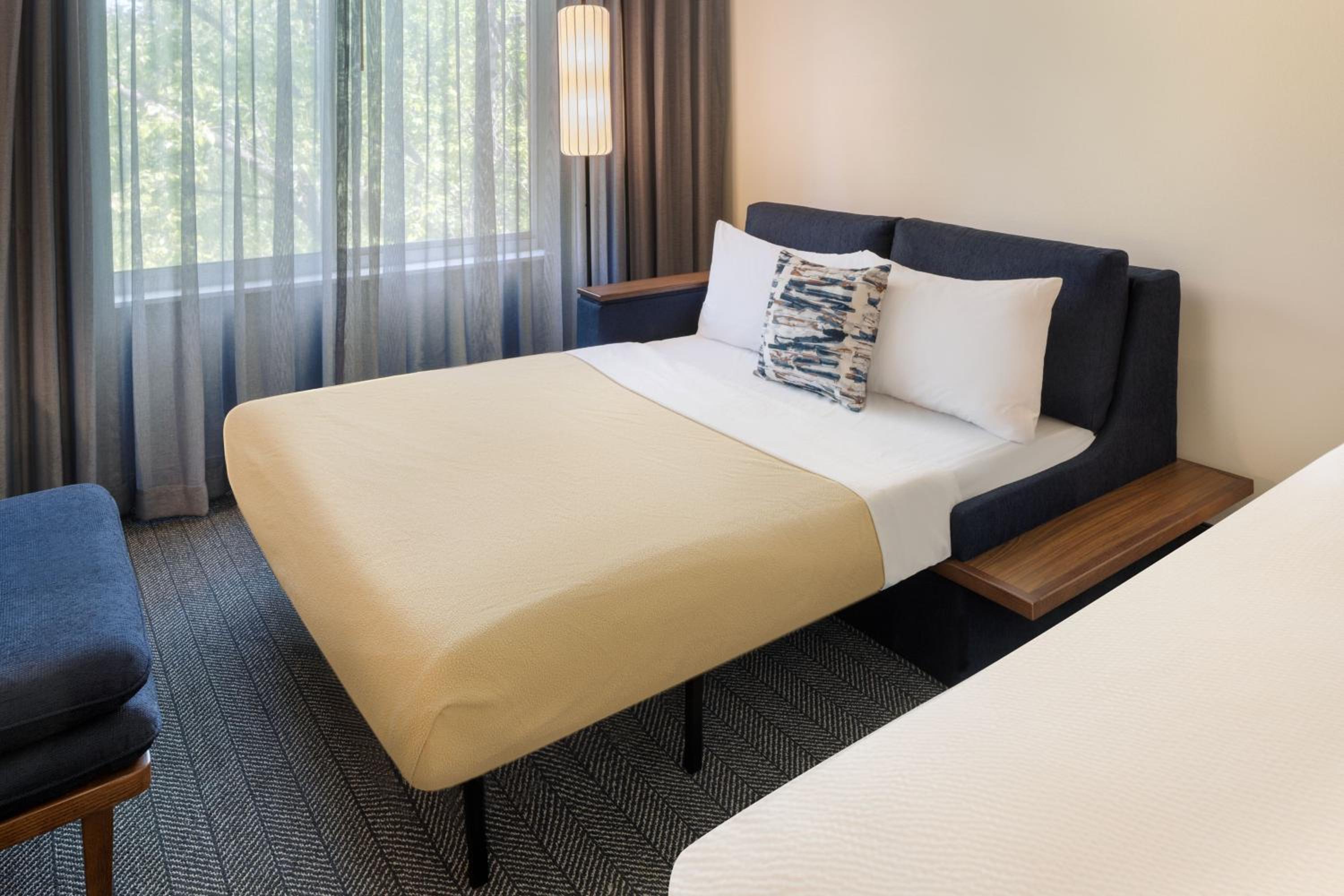 Deluxe Queen Room with Two Queen Beds and Sofa Bed