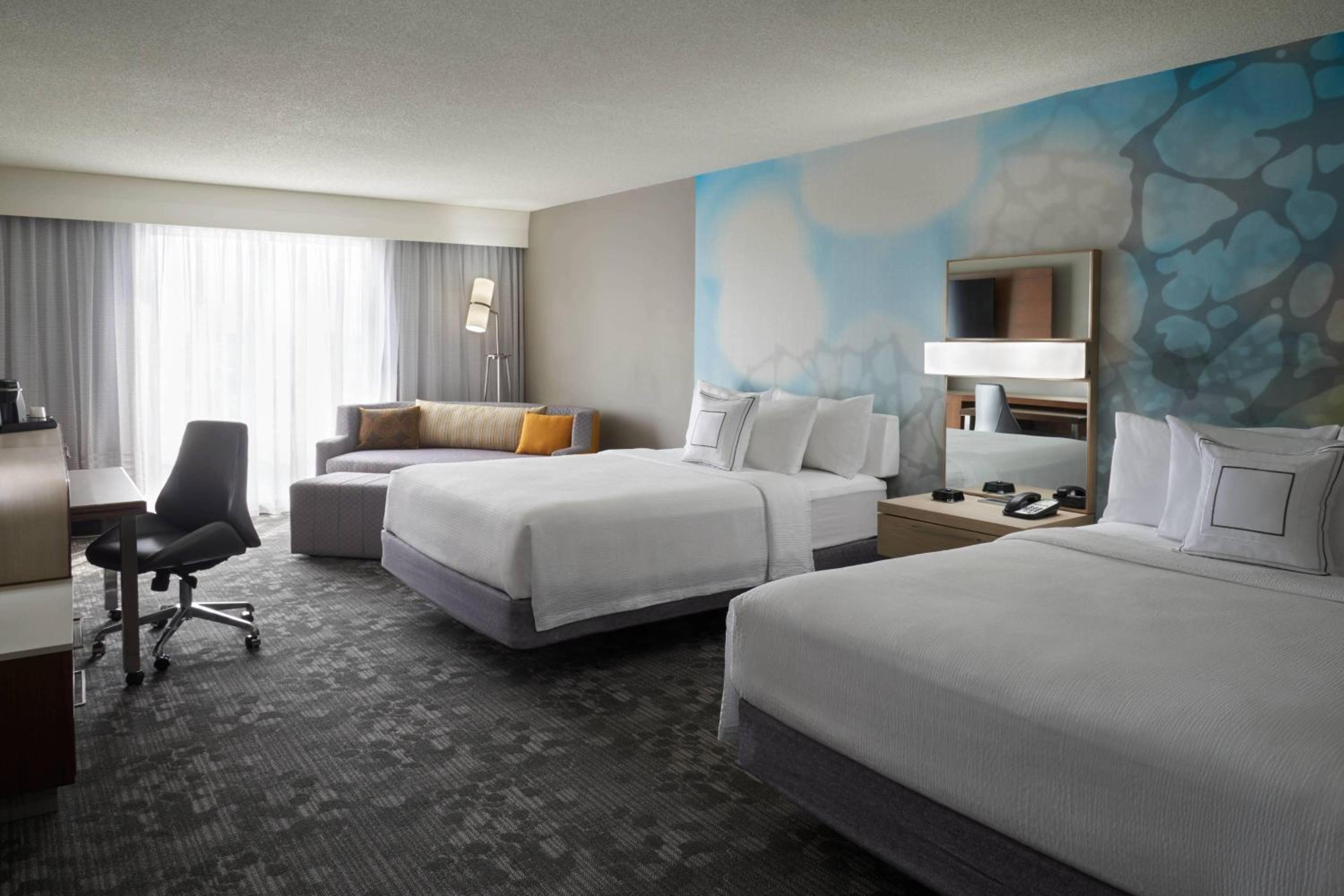 Larger Queen Room with Two Queen Beds and Sofa Bed - Photo 1