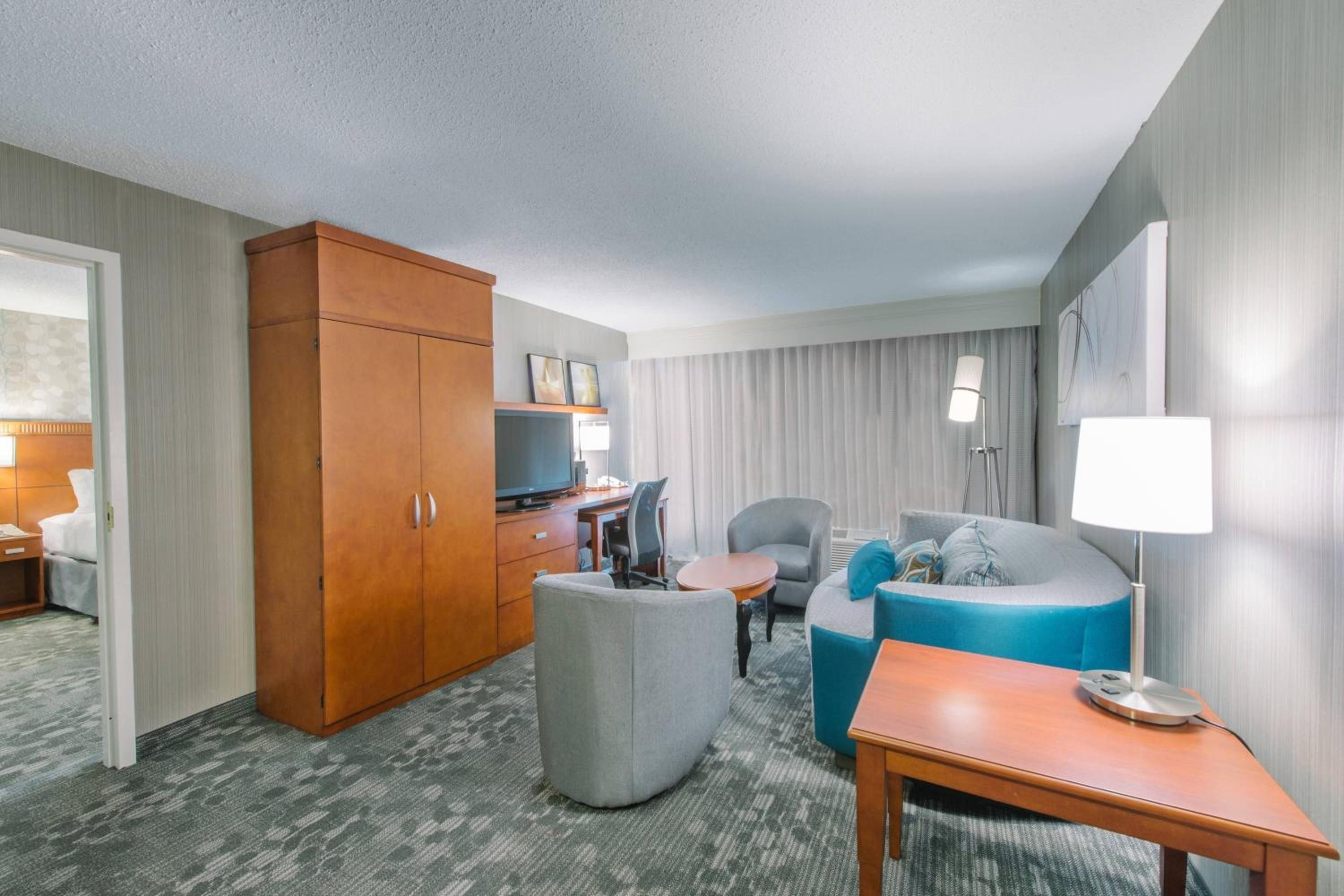 One-Bedroom King Suite with Roll-In Shower, Specialty Furniture and Sofa Bed - Mobility Access/Hearing Accessible - Photo 2