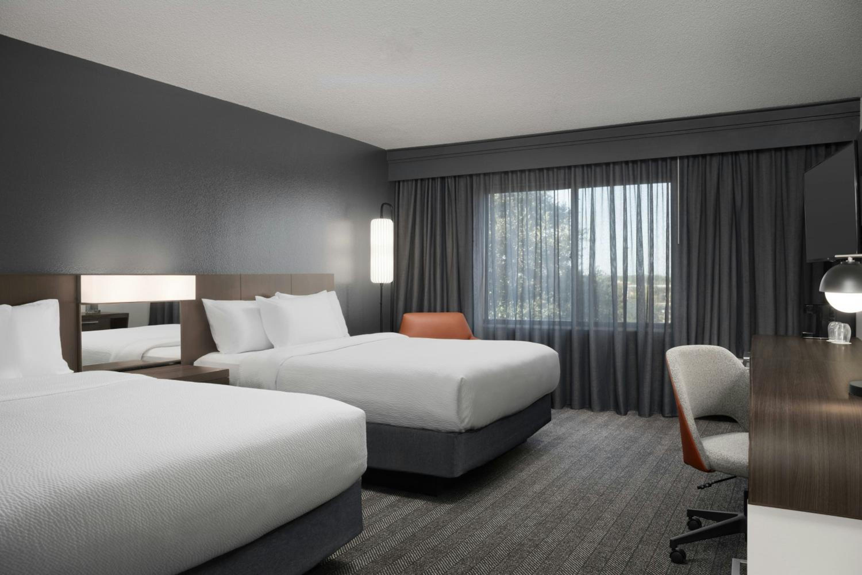 Queen Room with Two Queen Beds - Hearing Accessible - Photo 1