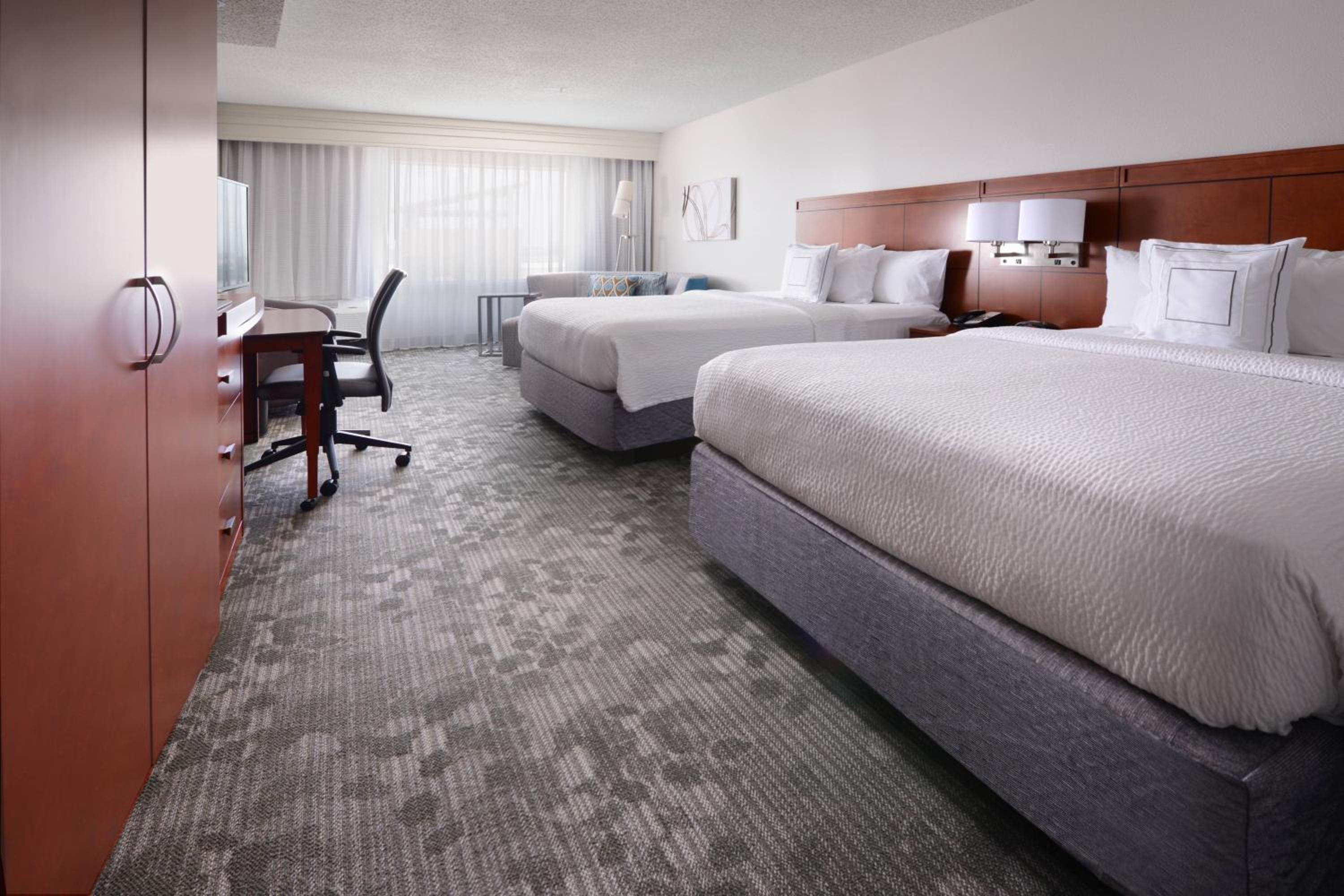 Queen Room with Two Queen Beds and Sofa Bed - Hearing Accessible photo 1
