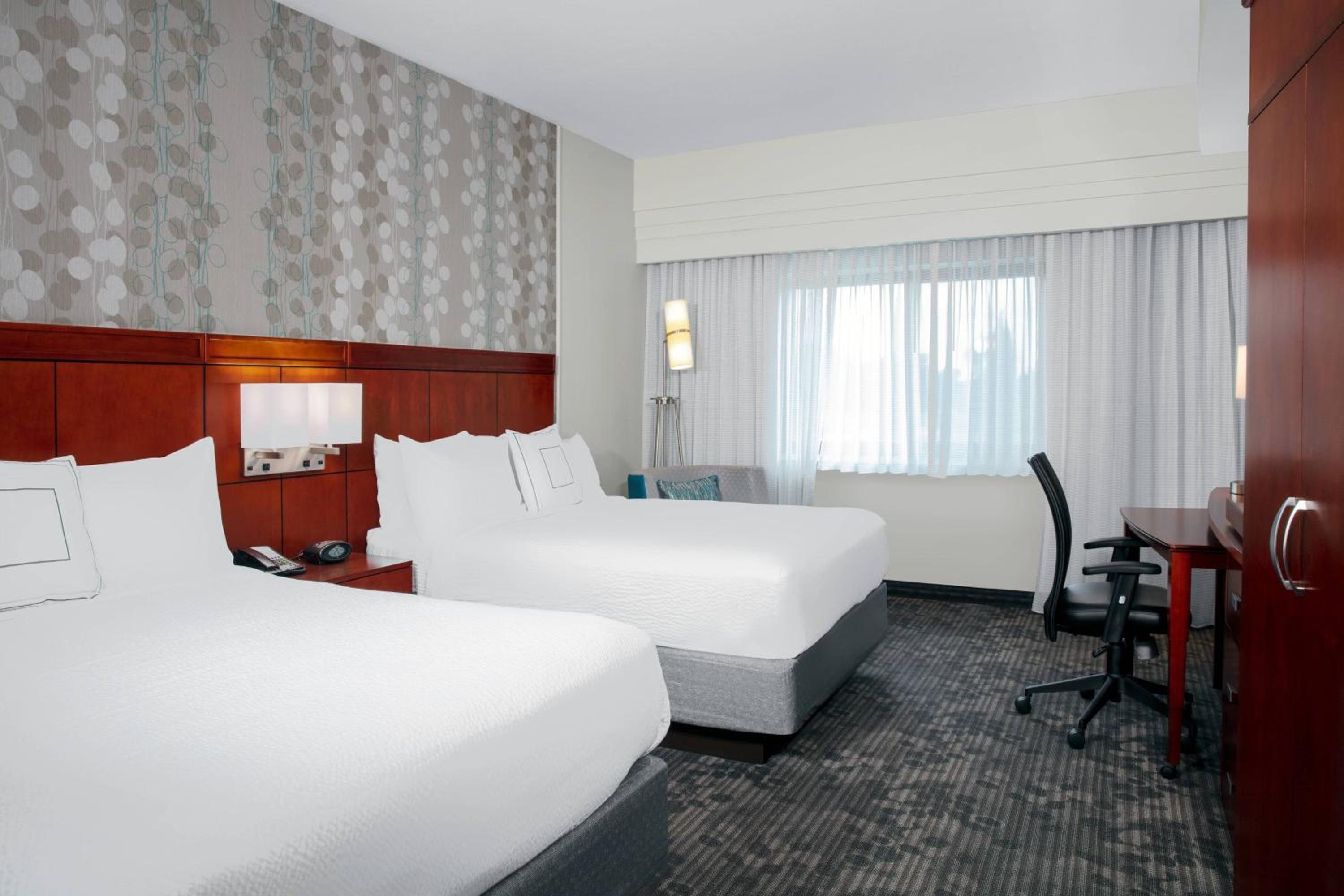 Queen Room with Two Queen Beds and Sofa Bed - Photo 9