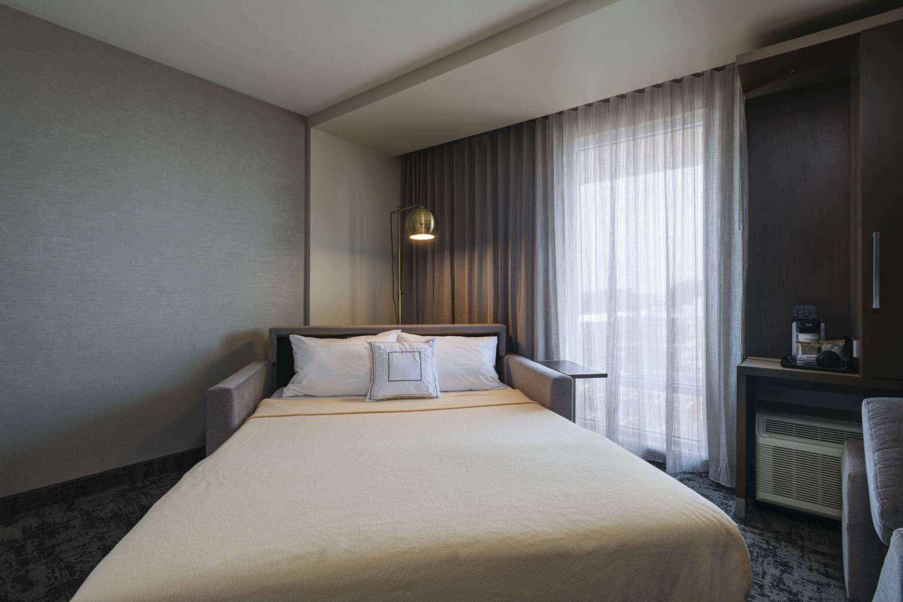 One-Bedroom Suite with Two Queen Beds and Sofa Bed - Mobility and Hearing Accessible with Roll-in Shower
