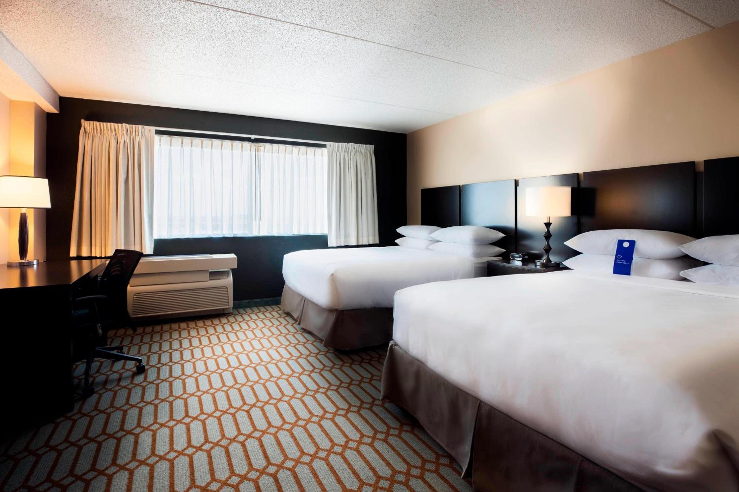 Guest Room with Two Queen Beds and One Sofa Bed - Pool View photo 1
